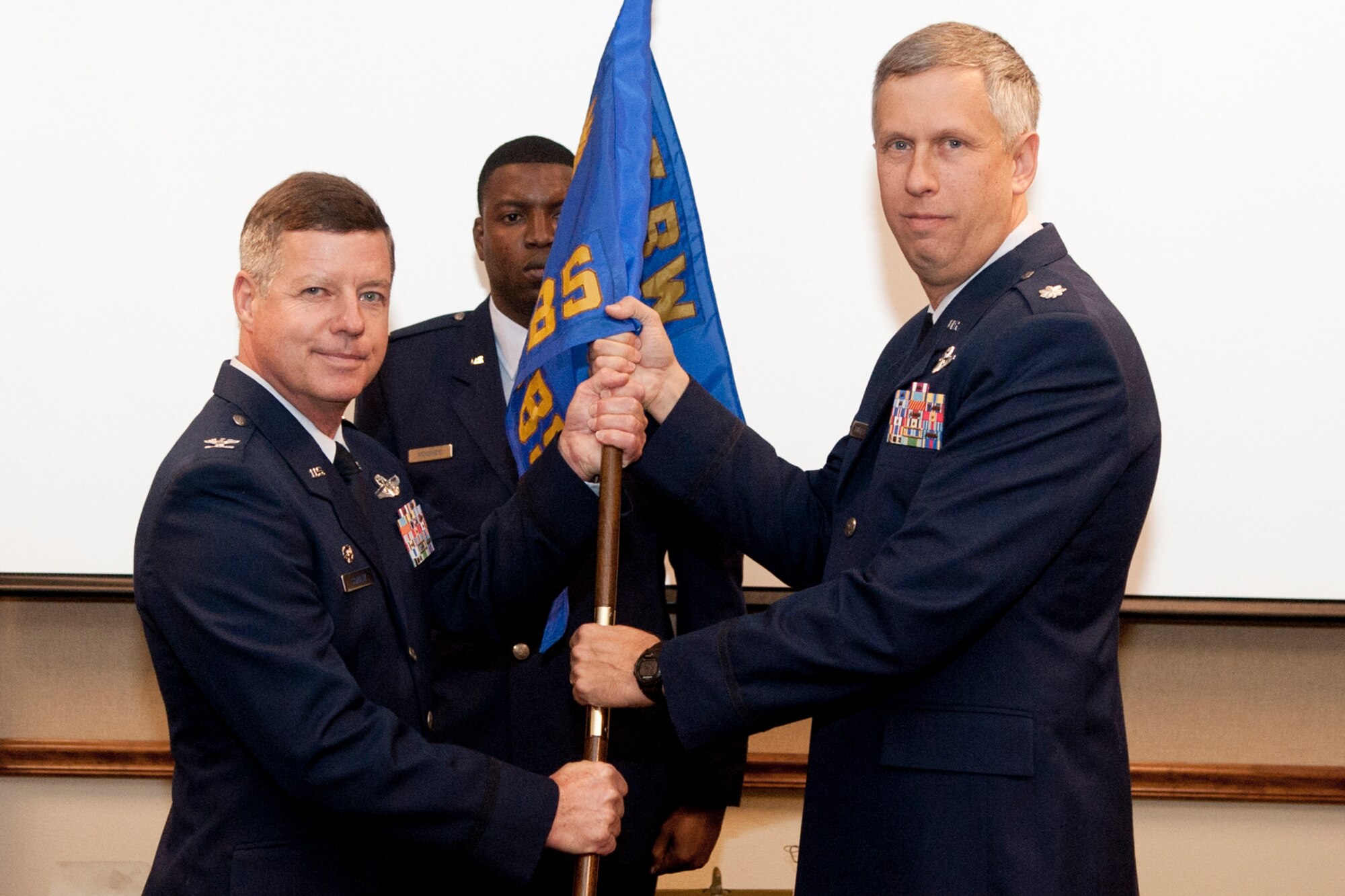 With the passing of the guidon from Colonel Keith Schultz, commander, 307th Operations Group, Lt. Col.  Robert N. Burgess takes the reins of the 343rd Bomb Squadron during a change of command ceremony in the 93rd Bomb Squadron Headquarters building at Barksdale Air Force Base, La., Oct. 21, 2013. (U.S. Air Force photo by Master Sgt. Jeff Walston)