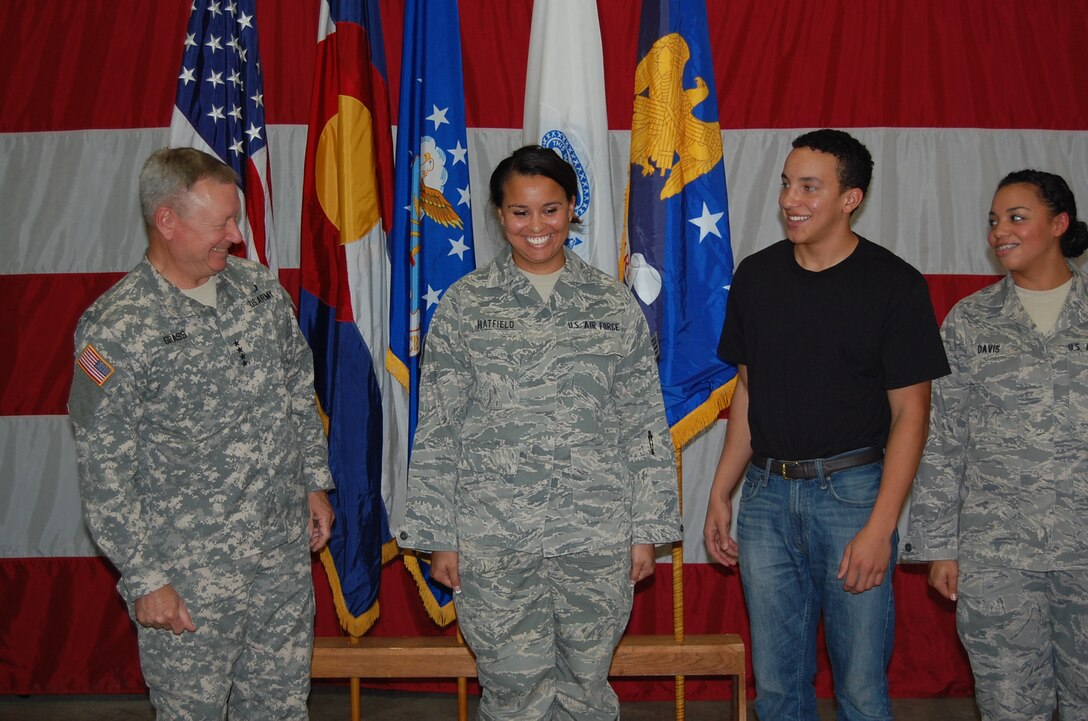 Gen. Frank Grass, chief, National Guard Bureau, spoke to the 233d Space Group during his visit and afterwards helped present awards and promote two individuals from the unit.  Senior Airman Amber Hatfield, 233 SG, earned another stripe to become a Staff Sergeant during the event. (Air National Guard photo by Capt. Kinder Blacke)