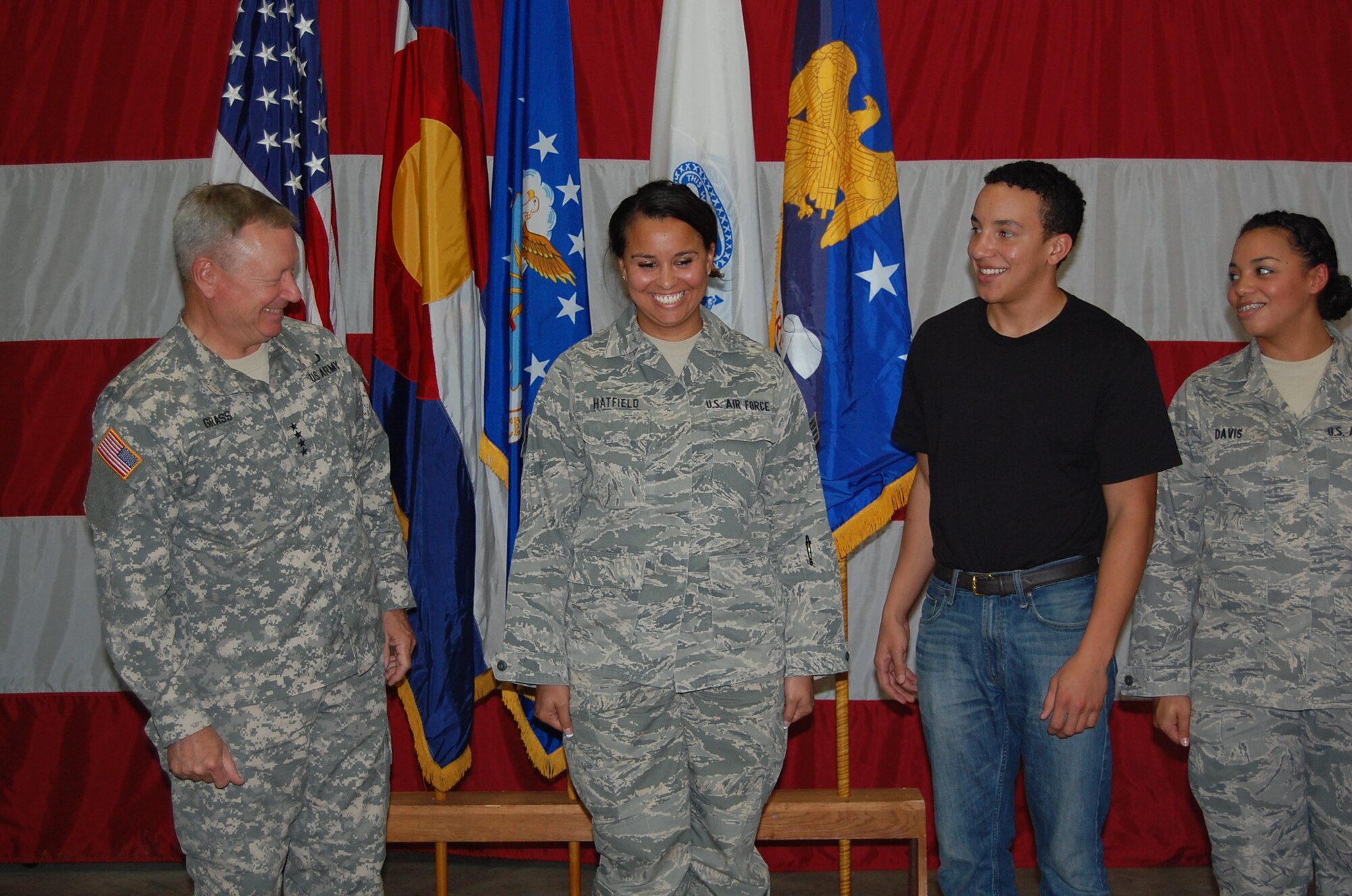 Gen. Frank Grass, chief, National Guard Bureau, spoke to the 233d Space Group during his visit and afterwards helped present awards and promote two individuals from the unit.  Senior Airman Amber Hatfield, 233 SG, earned another stripe to become a Staff Sergeant during the event. (Air National Guard photo by Capt. Kinder Blacke)