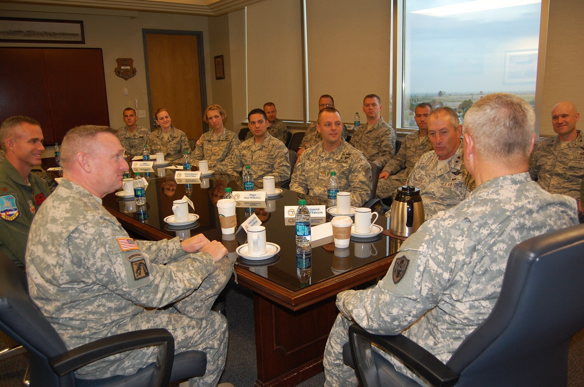 Gen. Frank Grass, chief, National Guard Bureau, addresses hot topics with members of the Colorado National Guard during a roundtable discussion Sept. 14, 2013. Issues discussed included budget concerns, deployments, physical fitness standards, and the value of the Guard. (Air National Guard photo by Capt. Kinder Blacke)