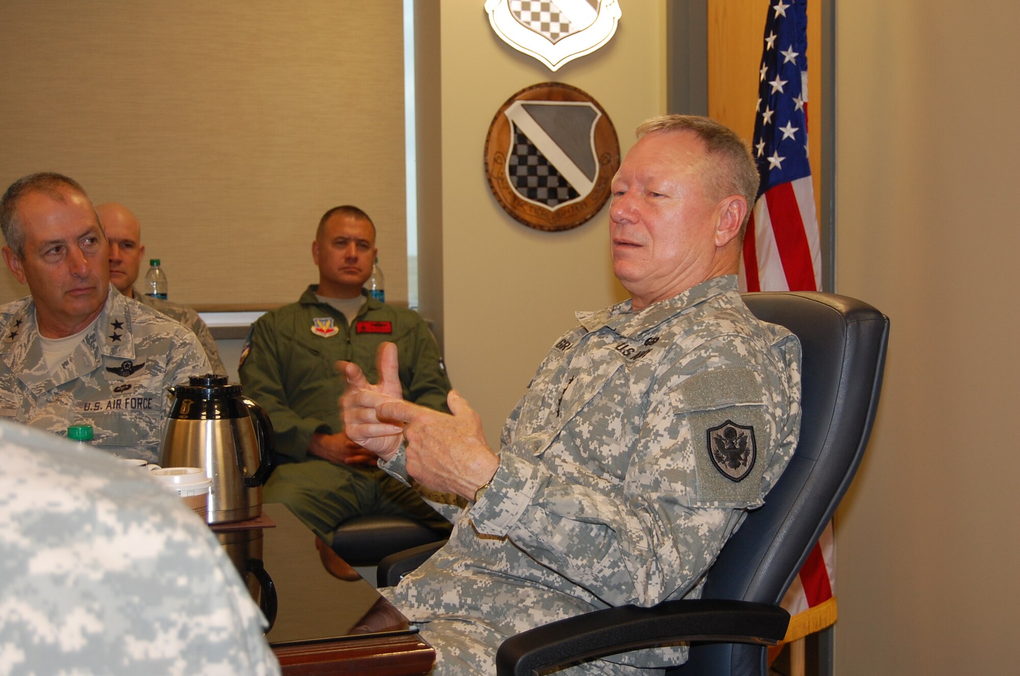 Gen. Frank Grass, chief, National Guard Bureau, addresses hot topics with members of the Colorado National Guard during a roundtable discussion Sept. 14, 2013. Issues discussed included budget concerns, deployments, physical fitness standards, and the value of the Guard. (Air National Guard photo by Capt. Kinder Blacke)