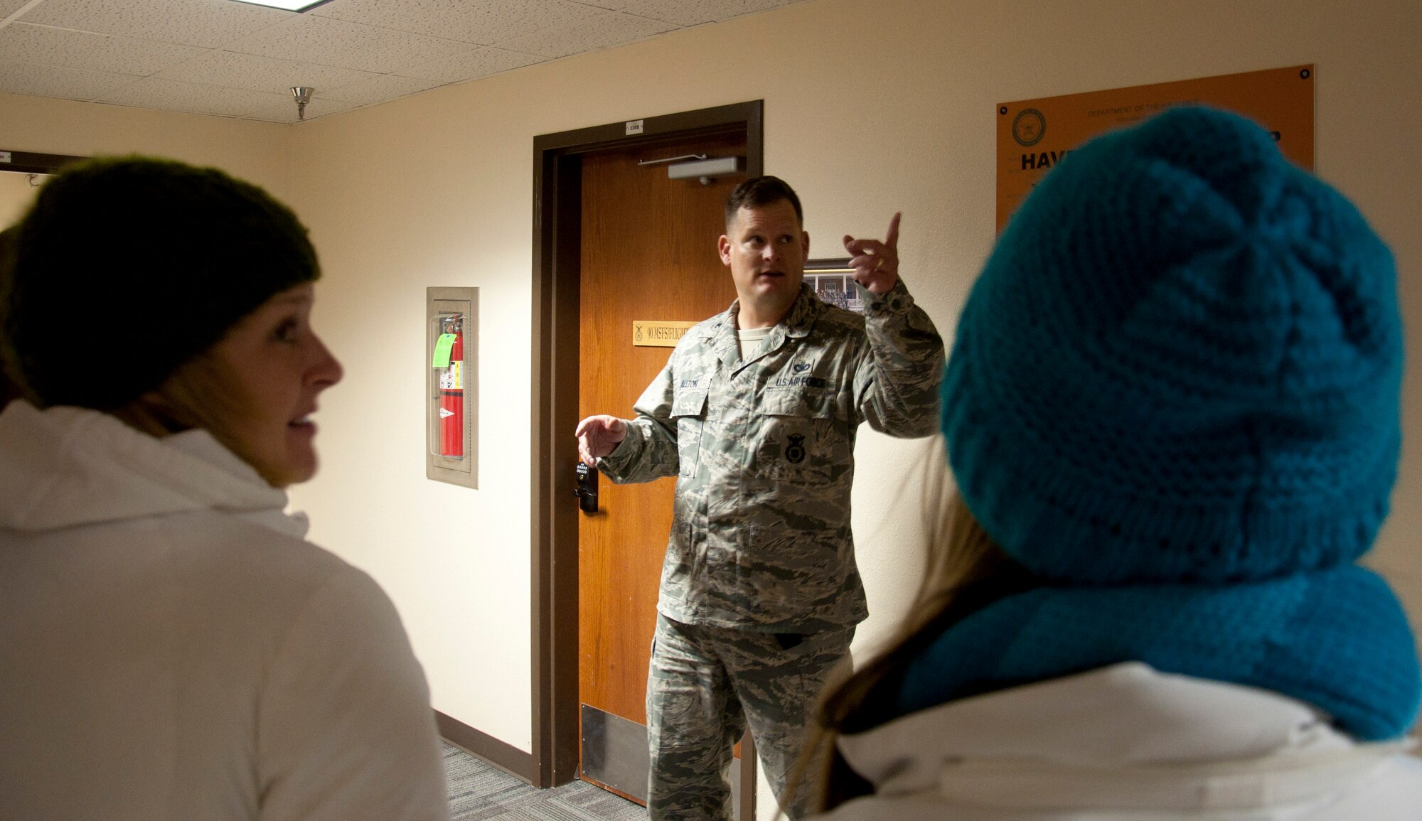 131015-F-GZ967-019 Col. Craig Allton, 90th Security Forces Group commander, tells a tale during a tour of the security forces building as part of the haunted scavenger hunt Oct. 15, 2013, of the one of the mysterious incidents he had encountered many years ago on the third floor of the building. The 90th Security Forces Group created a mini-tour for the participants, including a visit to a few of the “suspected” haunted rooms in the building – the third floor storage room, the basement boiler room, and a ride on the haunted elevator. (U.S. Air Force photo by Airman 1st Class Brandon Valle)