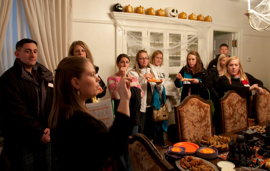 131015-F-GZ967-009 Tiffanie Newcomer, the Warren Spouses’ Club First Vice President, gives a safety briefing and the rules of the haunted scavenger hunt Oct. 15, 2013, inside the dining room of Col. Tracey Hayes, 90th Missile Wing commander. The rules were simple, follow each clue to find the destination, and receive a key word from the volunteers at the location. The fastest overall time of the 12 participating teams would be the winners. (U.S. Air Force photo by Airman 1st Class Brandon Valle)