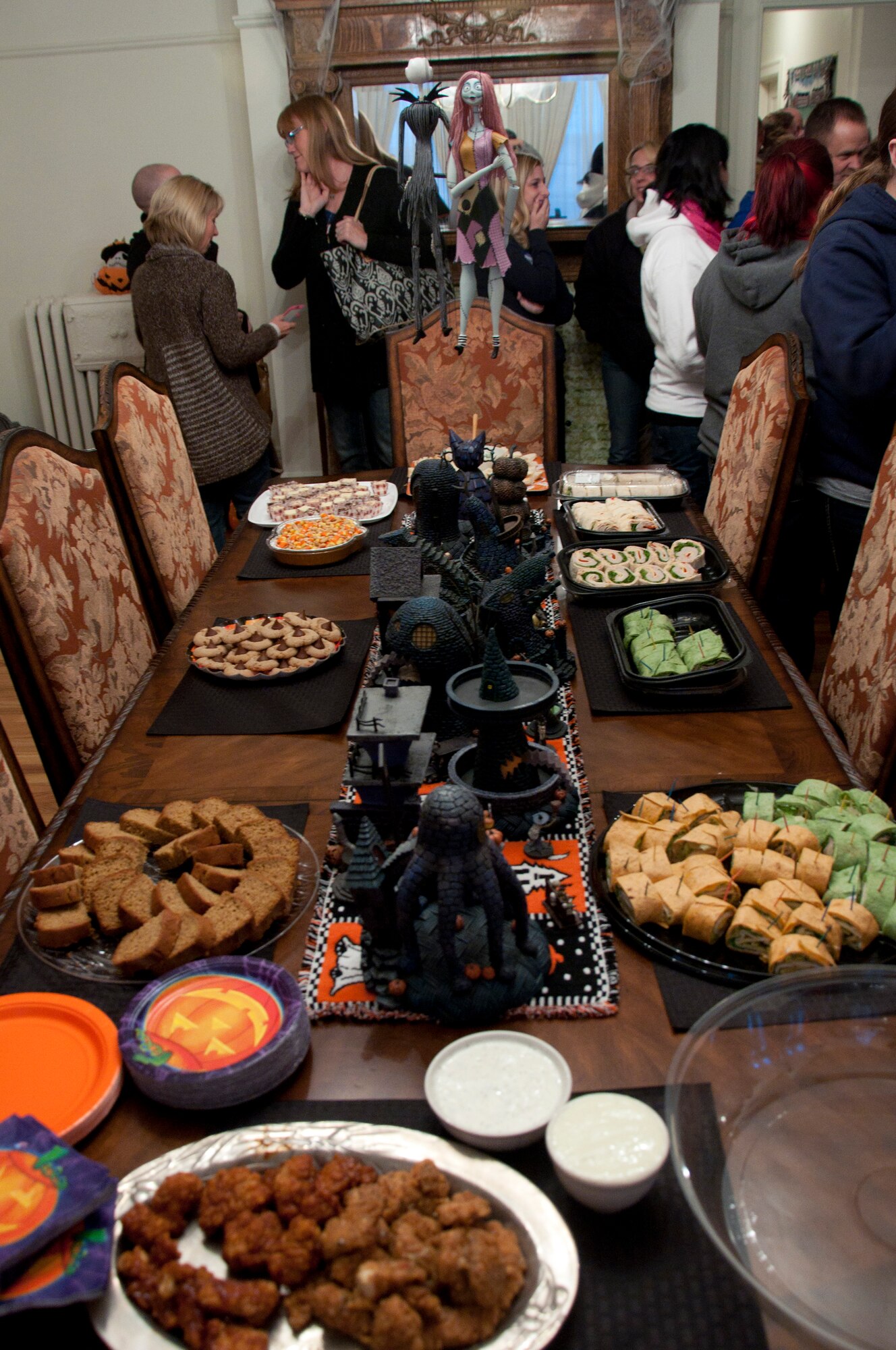 131015-F-GZ967-008 The Warren Spouses’ Club laid out a wide selection of food choices for the participants of the haunted scavenger hunt Oct. 15, 2013. The WSC took over the dining room and living room areas of Col. Tracey Hayes, 90th Missile Wing commander, as the launch point for the scavenger hunt. (U.S. Air Force photo by Airman 1st Class Brandon Valle)