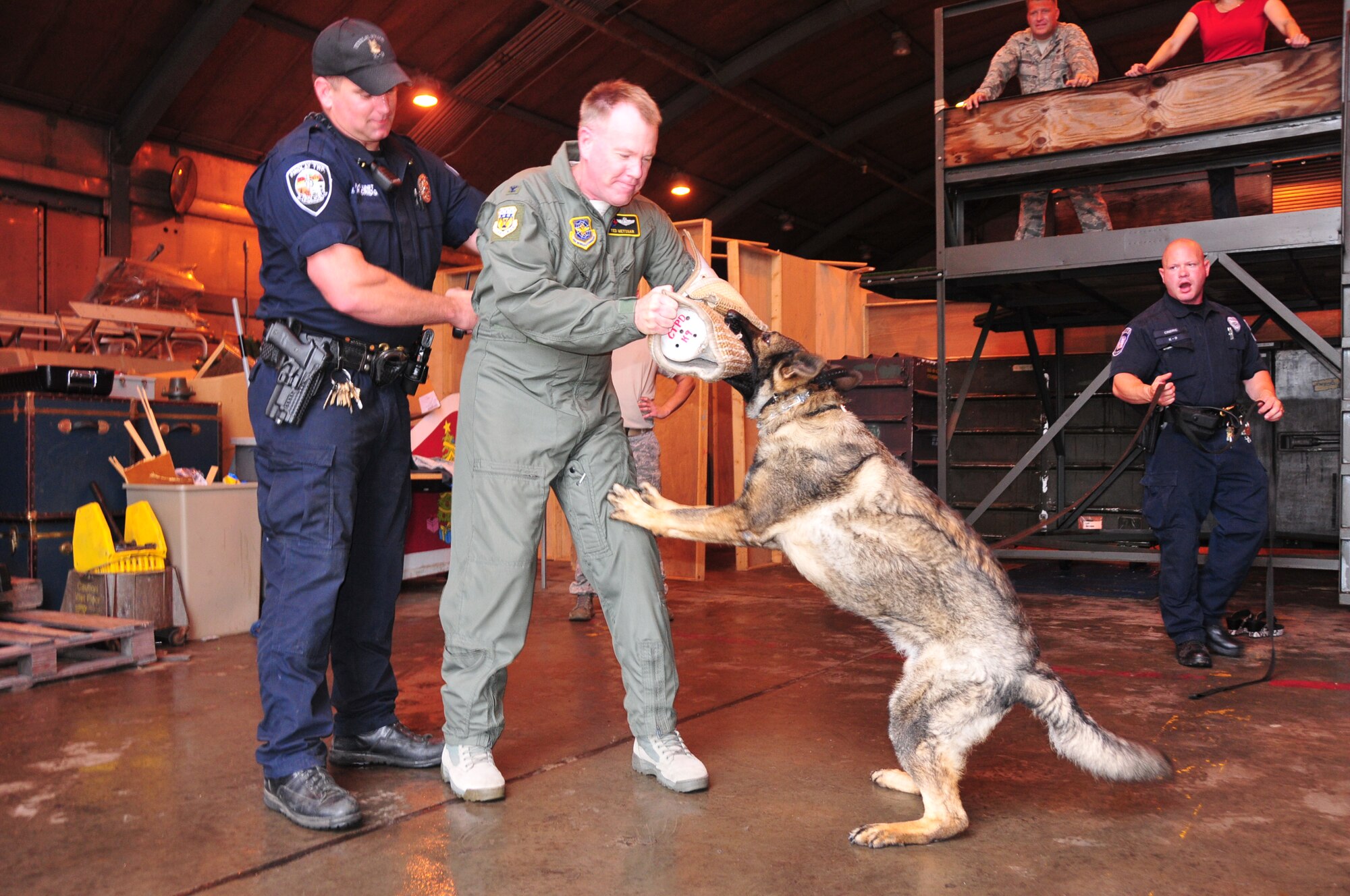 The 171st Air Refueling Wing, located near Pittsburgh, Pennsylvania, provides a secure location for local law enforcement agencies to train their K-9 units, August 28, 2013. Beaver County, Center Township, Findlay Township and Scott Township Police Departments attended. K-9 units must continuously train on building, vehicle, area, and evidence searches to fulfill training requirements. Training also includes apprehension, narcotic detection, tracking scenarios, and handler protection.  Having a secure, controlled location is important for efficient training and for the safety of the dogs. In addition to fulfilling training requirements, this combined effort also allows the 171st and local law enforcement agencies the ability to share ideas and training techniques in order to better serve the community and the commonwealth (U.S. Air National Guard Photo by Tech. Sgt. Shawn Monk/Released)