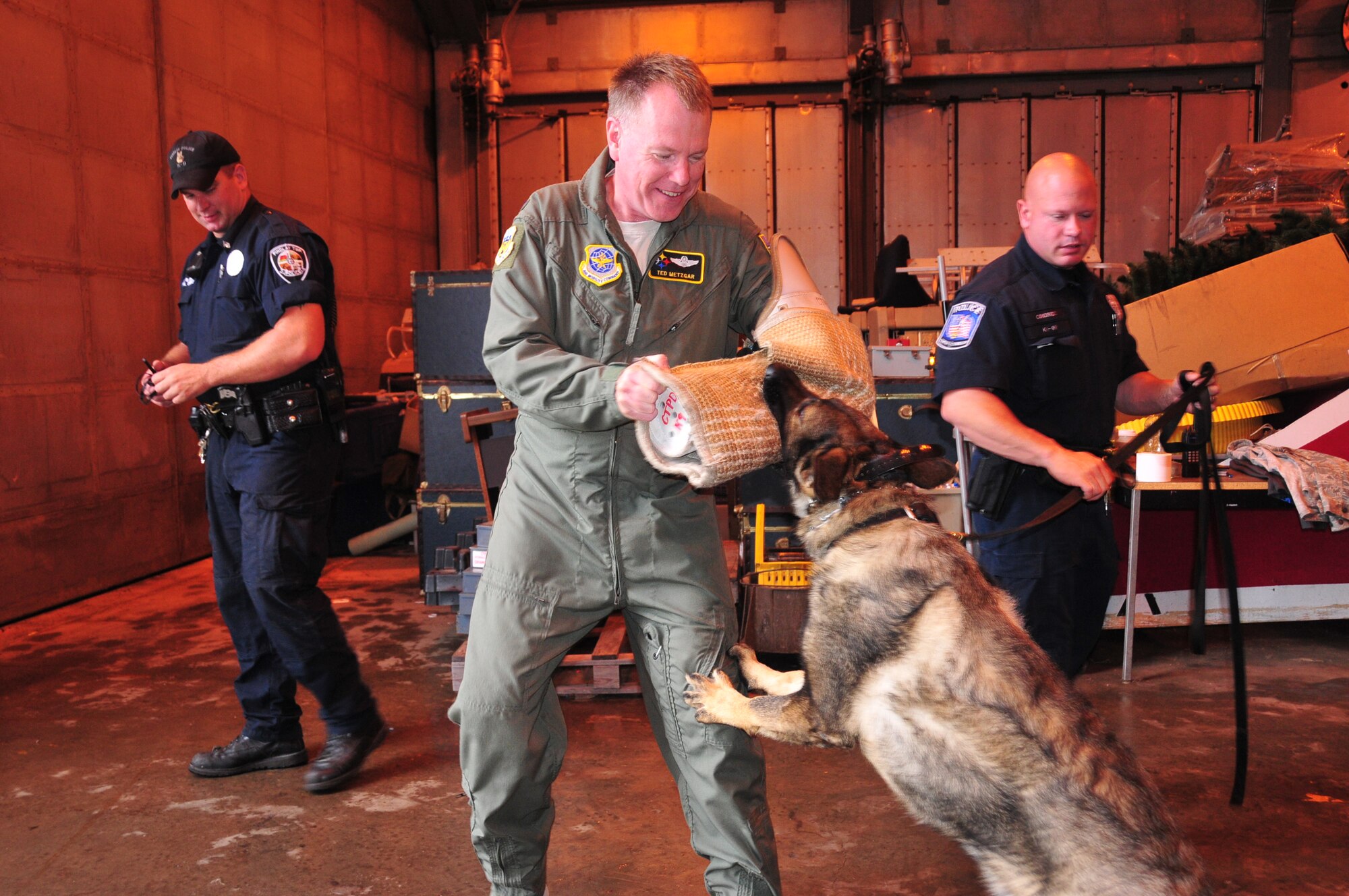 The 171st Air Refueling Wing, located near Pittsburgh, Pennsylvania, provides a secure location for local law enforcement agencies to train their K-9 units, August 28, 2013. Beaver County, Center Township, Findlay Township and Scott Township Police Departments attended. K-9 units must continuously train on building, vehicle, area, and evidence searches to fulfill training requirements. Training also includes apprehension, narcotic detection, tracking scenarios, and handler protection.  Having a secure, controlled location is important for efficient training and for the safety of the dogs. In addition to fulfilling training requirements, this combined effort also allows the 171st and local law enforcement agencies the ability to share ideas and training techniques in order to better serve the community and the commonwealth (U.S. Air National Guard Photo by Tech. Sgt. Shawn Monk/Released)