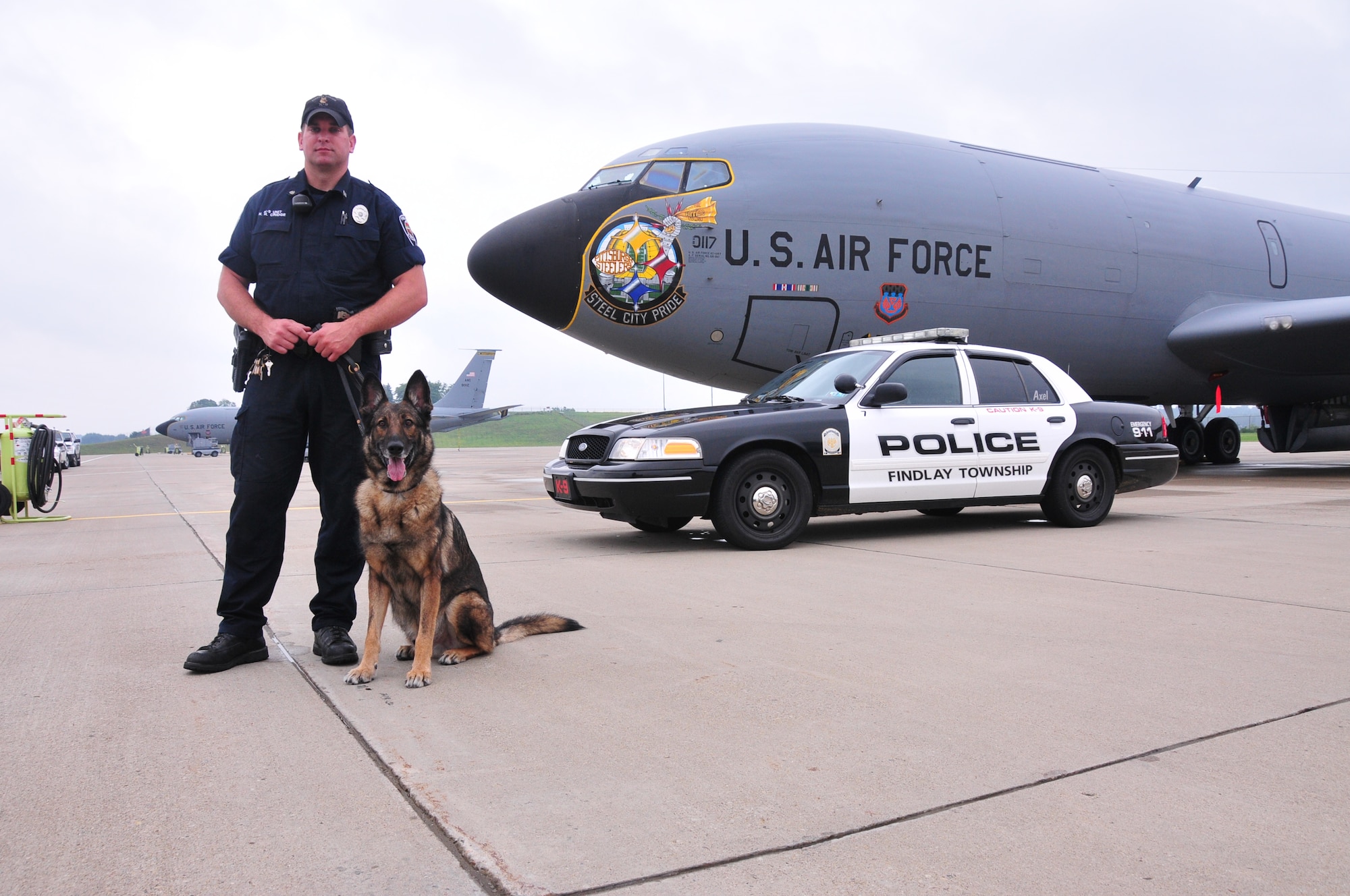 The 171st Air Refueling Wing, located near Pittsburgh, Pennsylvania, provides a secure location for local law enforcement agencies to train their K-9 units, August 28, 2013. Beaver County, Center Township, Findlay Township and Scott Township Police Departments attended. K-9 units must continuously train on building, vehicle, area, and evidence searches to fulfill training requirements. Training also includes apprehension, narcotic detection, tracking scenarios, and handler protection.  Having a secure, controlled location is important for efficient training and for the safety of the dogs. In addition to fulfilling training requirements, this combined effort also allows the 171st and local law enforcement agencies the ability to share ideas and training techniques in order to better serve the community and the commonwealth (U.S. Air National Guard Photo by Tech. Sgt. Shawn Monk/Released)