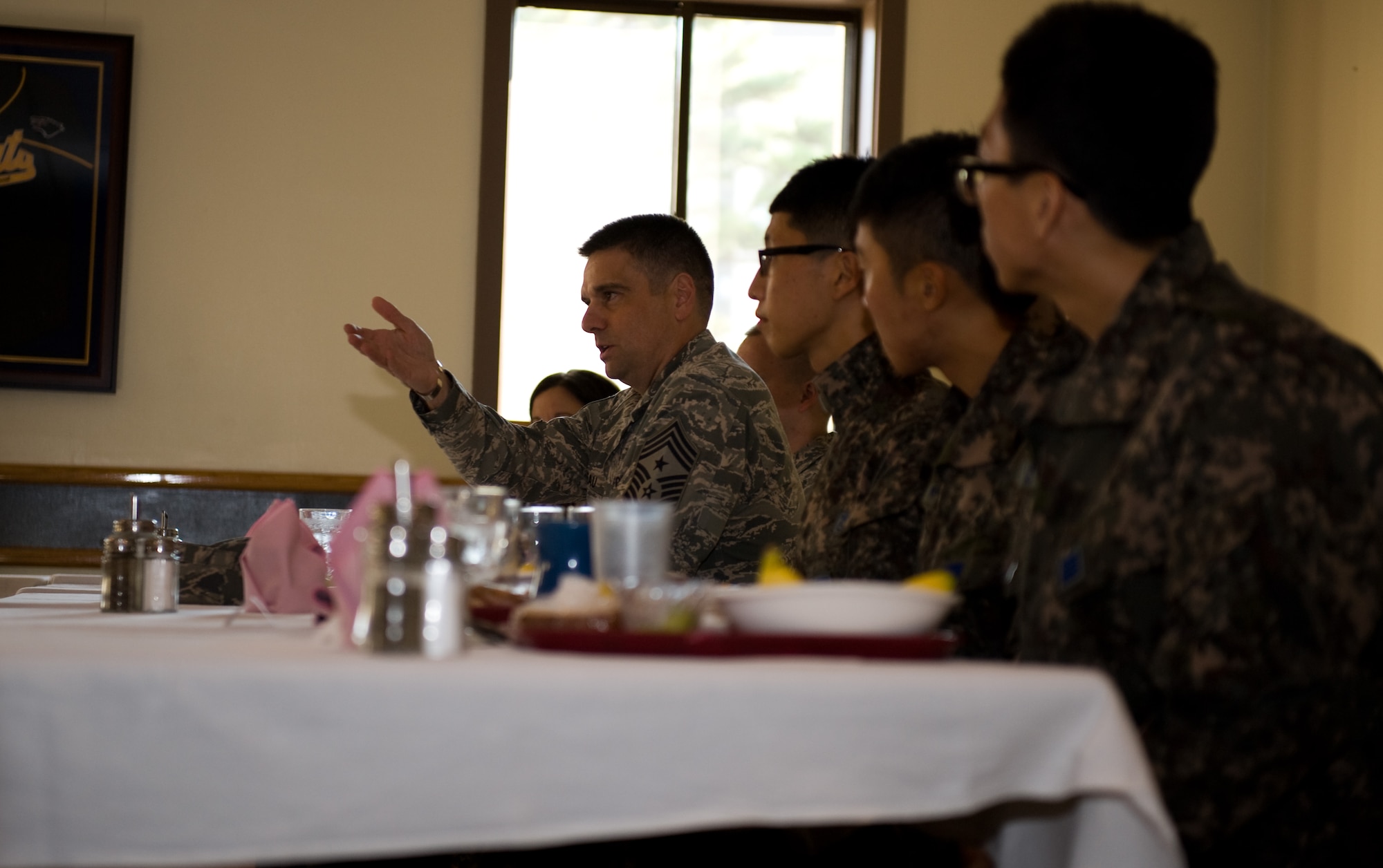 Chief Master Sgt. Scott Delveau, 7th Air Force command chief, speaks to Airmen from both the U.S. and Republic of Korea air forces at Kunsan Air Base, Republic of Korea, Oct. 22, 2013. Delveau toured the base along with his Republic of Korea counterpart, Chief Master Sgt. Byung Gyu Kim, Republic of Korea air force operations command command chief. (U.S. Air Force photo by Senior Airman Armando A. Schwier-Morales/Released) 