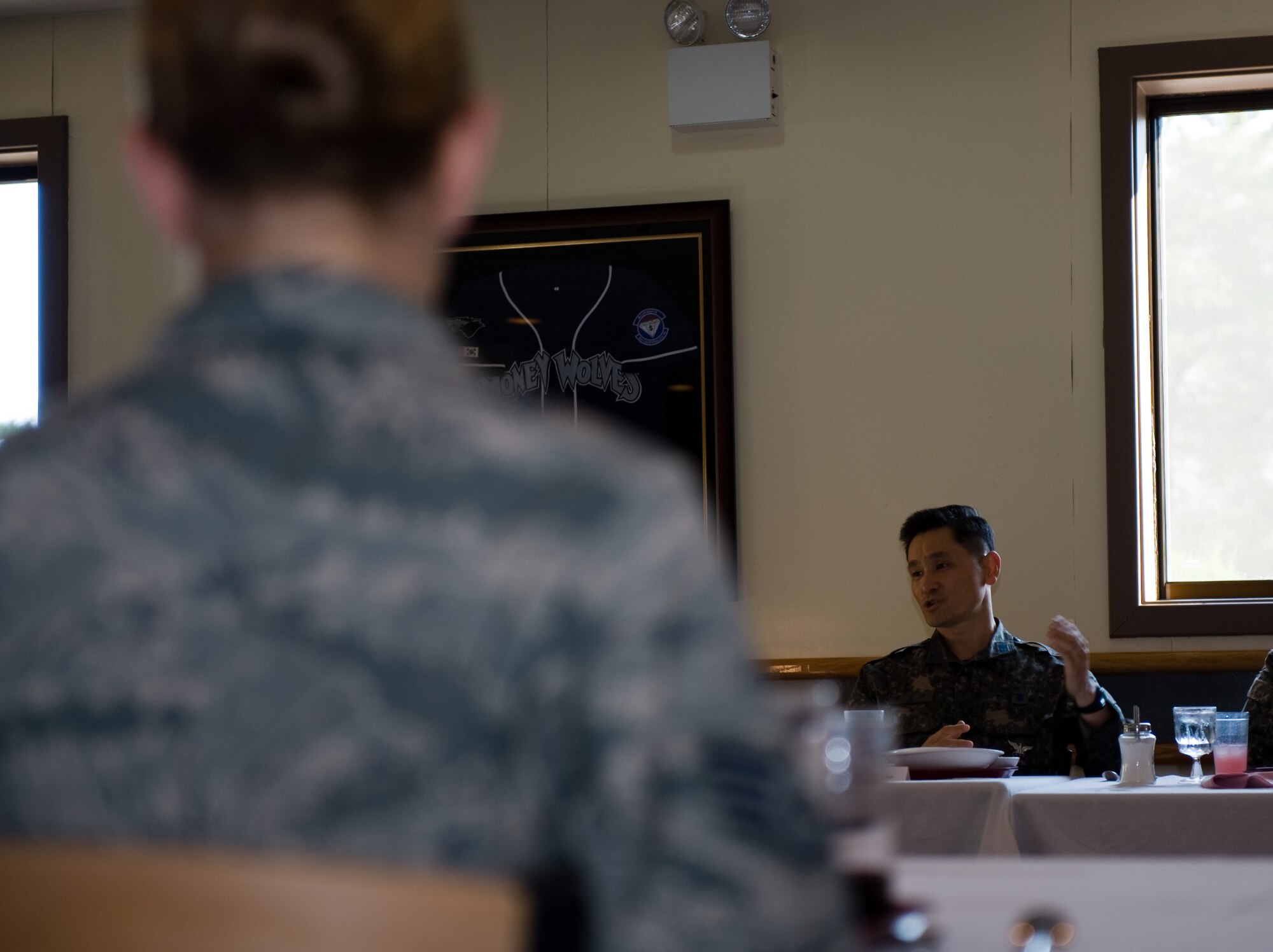 Chief Master Sgt. Byung Gyu Kim, Republic of Korea air force operations command command chief, speaks to U.S. and Republic of Korea Airmen during a breakfast at Kunsan Air Base, Republic of Korea, Oct. 22, 2013. Kim and Chief Master Sgt. Scott Delveau, 7th Air Force command chief, toured Kunsan and held an all-call during their visit. (U.S. Air Force photo by Senior Airman Armando A. Schwier-Morales/Released) 