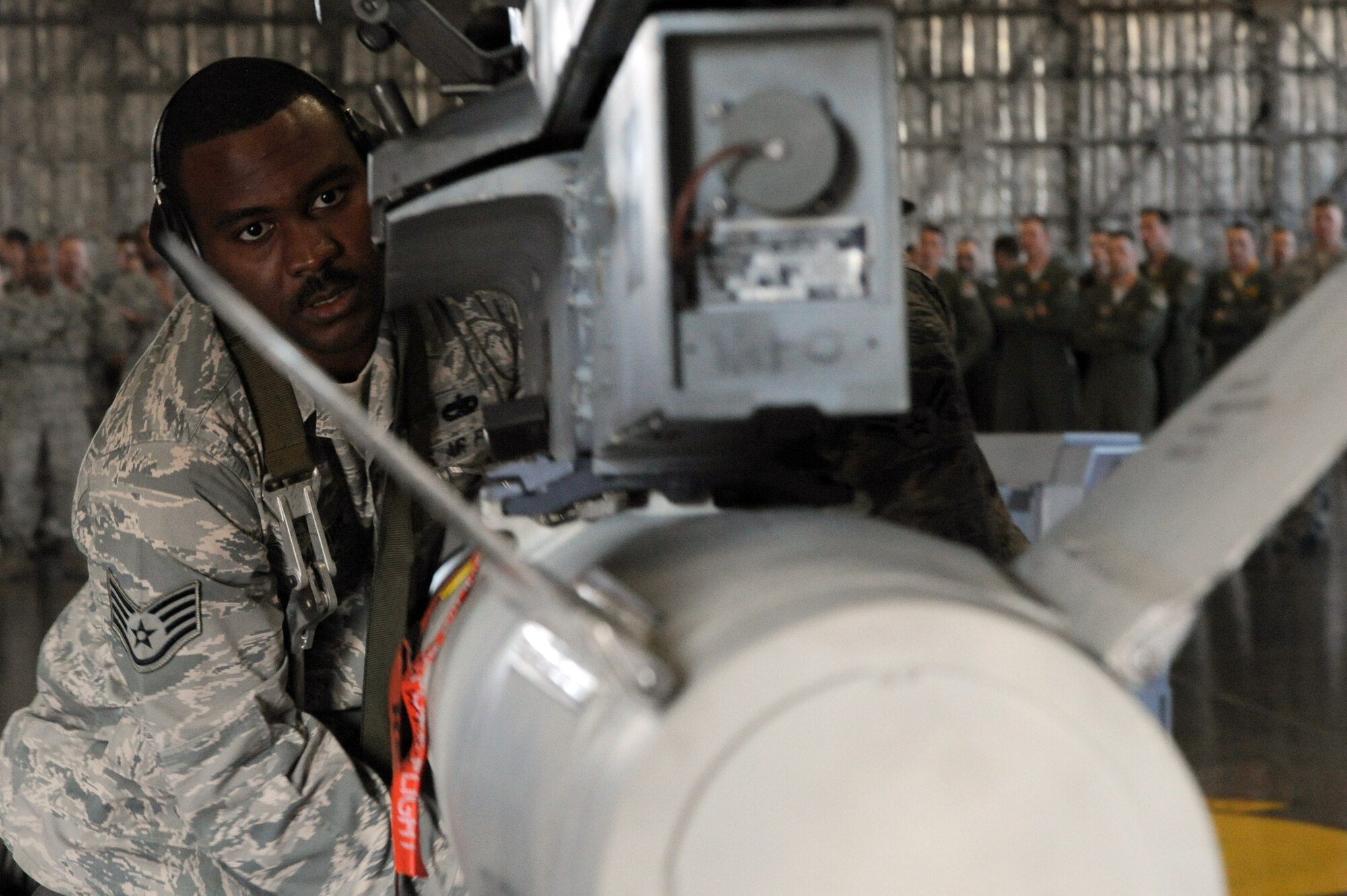 U.S. Air Force Staff Sgt. Ryan Baldwin, 13th Aircraft Maintenance Unit weapons load team chief, loads an AGM-88 High-speed Anti-radiation Missile during the Load Crew of the Quarter competition at Misawa Air Base, Japan, Oct. 18, 2013. Baldwin was the weapons load team chief of a three-man crew that finished runner-up to maintainers from the 14 AMU. (U.S. Air Force photo by Senior Airman Derek VanHorn)