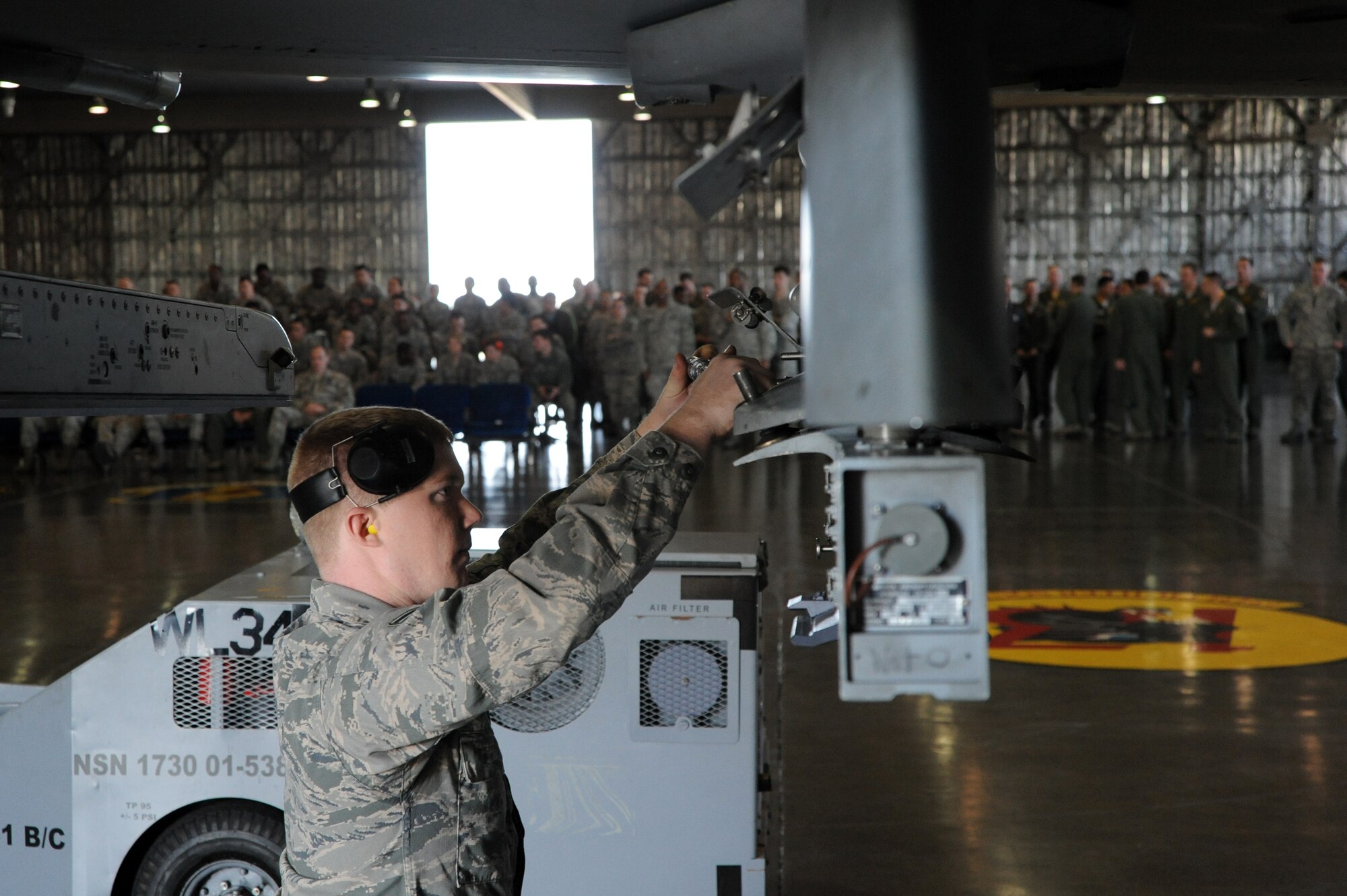 U.S. Air Force Airman 1st Class Zachary Kyes, 13th Aircraft Maintenance Unit weapons load crew member, prepares a LAU-129 Guided Missile Launcher before loading munitions during the Load Crew of the Quarter competition at Misawa Air Base, Japan, Oct. 18, 2013. Load crew competitions are held between two crews to evaluate who can prepare the aircraft for combat with fastest with the fewest procedural errors. (U.S. Air Force photo by Senior Airman Derek VanHorn)