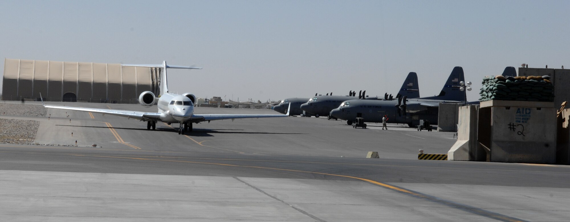 An E-11A taxis down the ramp at Kandahar Airfield, Afghanistan, Oct. 19, 2013. The E-11A is used as part of the Battlefield Airborne Communication Node mission here. (U.S. Air Force photo by Senior Airman Jack Sanders)