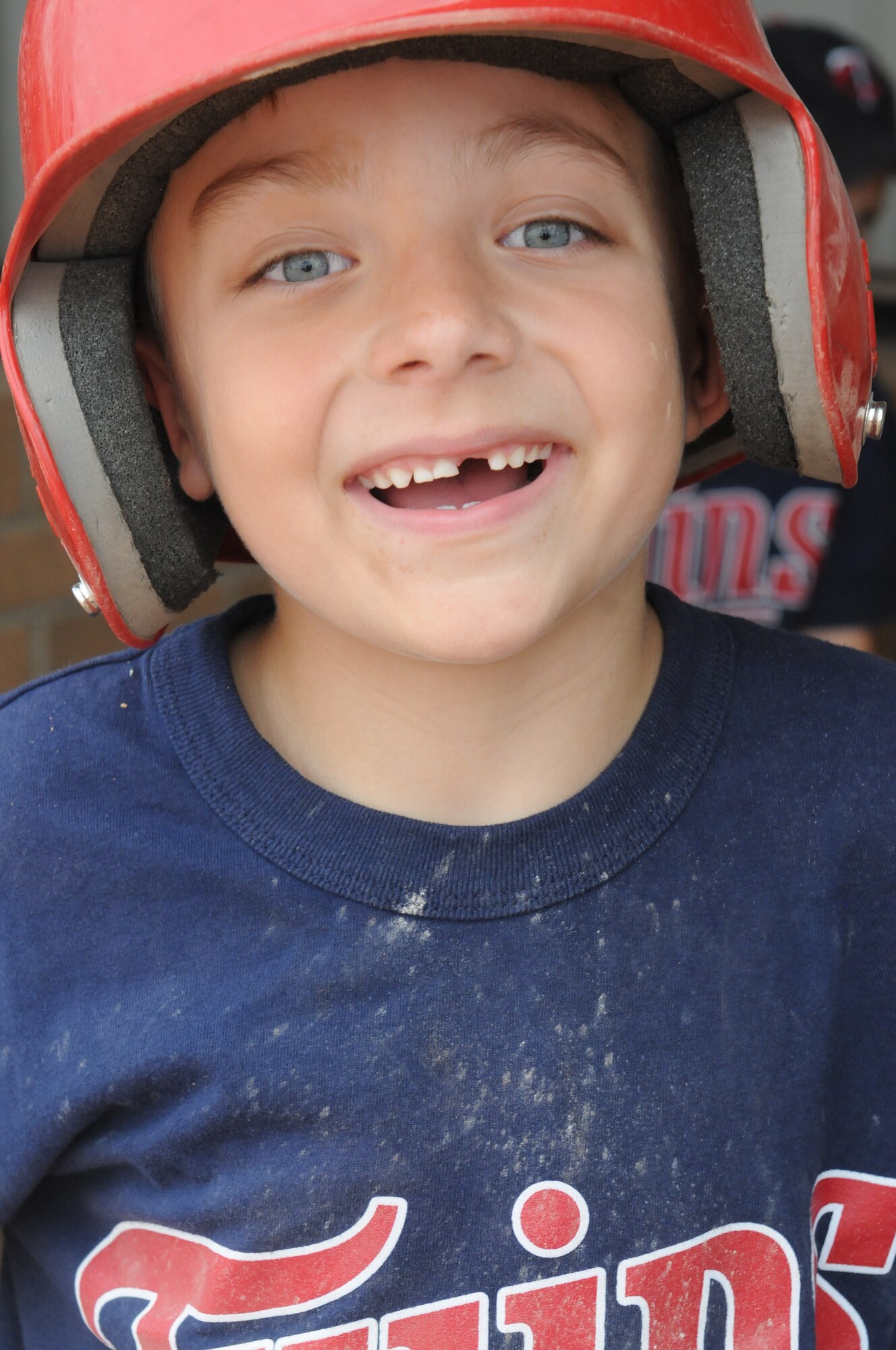 Branden Lee, 7, son of Tech. Sgt. Carissa Lee, 48th Fighter Wing public affairs NCO, celebrates after the 2013 Youth Baseball Championship game at Royal Air Force Lakenheath, England, Aug. 14, 2013. The Youth Sports Program offers children aged 5 to 18 a wide array of organized activities to help children develop desired physical skills, to mature emotionally and socially, and to learn the importance of teamwork. (U.S. Air Force photo by Tech. Sgt. Carissa Lee /Released)