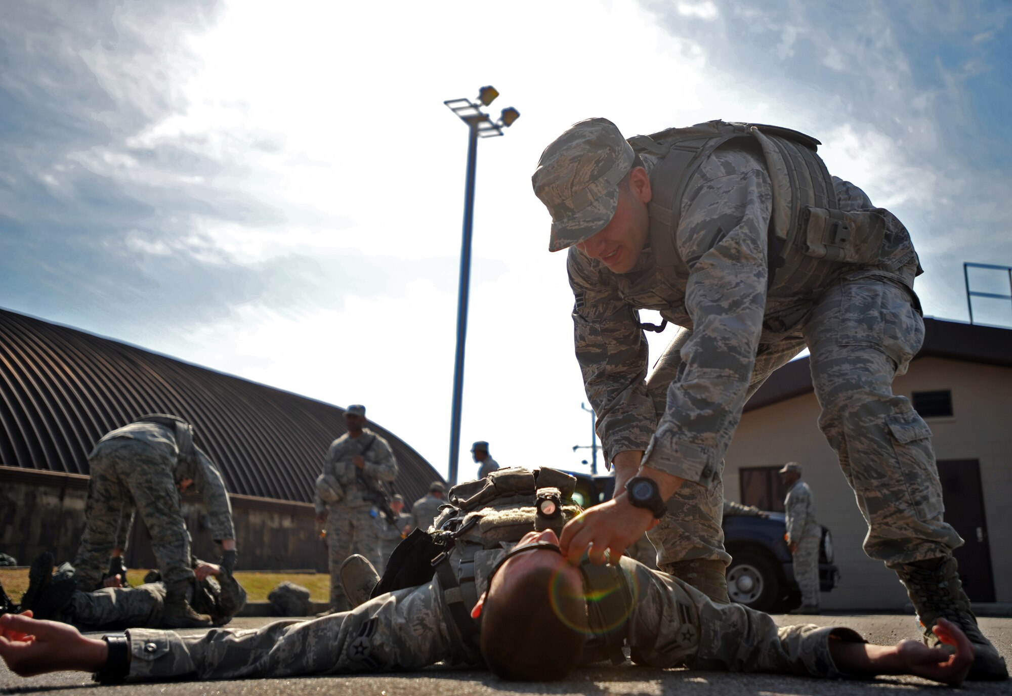 Senior Airman David Nama, 51st Security Forces Squadron fire team member, conducts a body check during a field training exercise at Osan Air Base, Republic of Korea, Oct. 17, 2013. Nama was one of many defenders that participated in the two-day exercise designed to test the 51st SFS’s ability to defend the base against any threat. (U.S. Air Force photo/Senior Airman Siuta B. Ika)