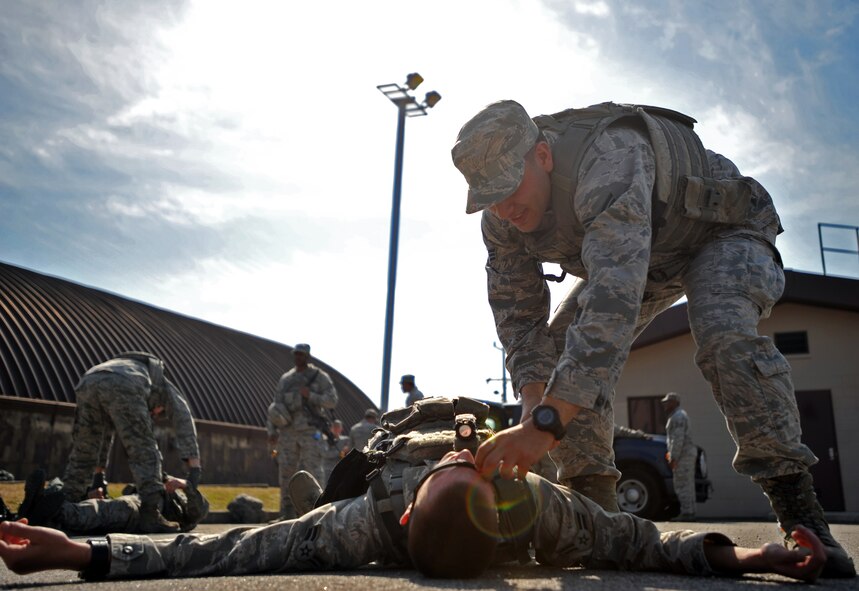 Senior Airman David Nama, 51st Security Forces Squadron fire team member, conducts a body check during a field training exercise at Osan Air Base, Republic of Korea, Oct. 17, 2013. Nama was one of many defenders that participated in the two-day exercise designed to test the 51st SFS’s ability to defend the base against any threat. (U.S. Air Force photo/Senior Airman Siuta B. Ika)