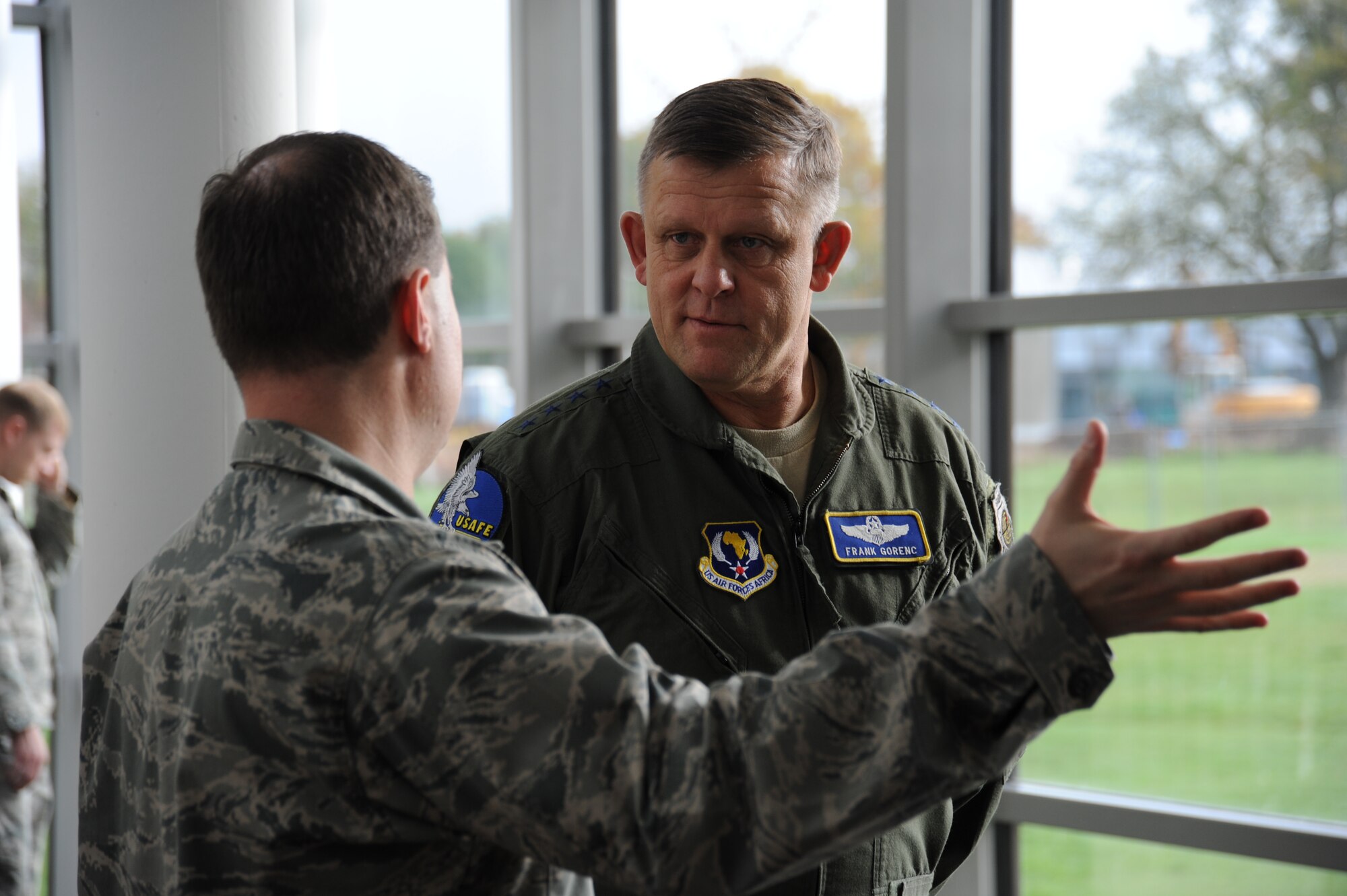SPANGDAHLEM AIR BASE, Germany --- Gen. Frank Gorenc, U.S. Air Forces in Europe and Air Forces Africa commander, right, listens as Lt. Col. Wade Adair, 52nd Medical Support Squadron commander, left, gives a tour of the 52nd Medical Group clinic Oct. 18, 2013. The general’s tour highlighted all four squadrons within the 52nd MDG. (U.S. Air Force photo by Senior Airman Joe W. McFadden / Released)