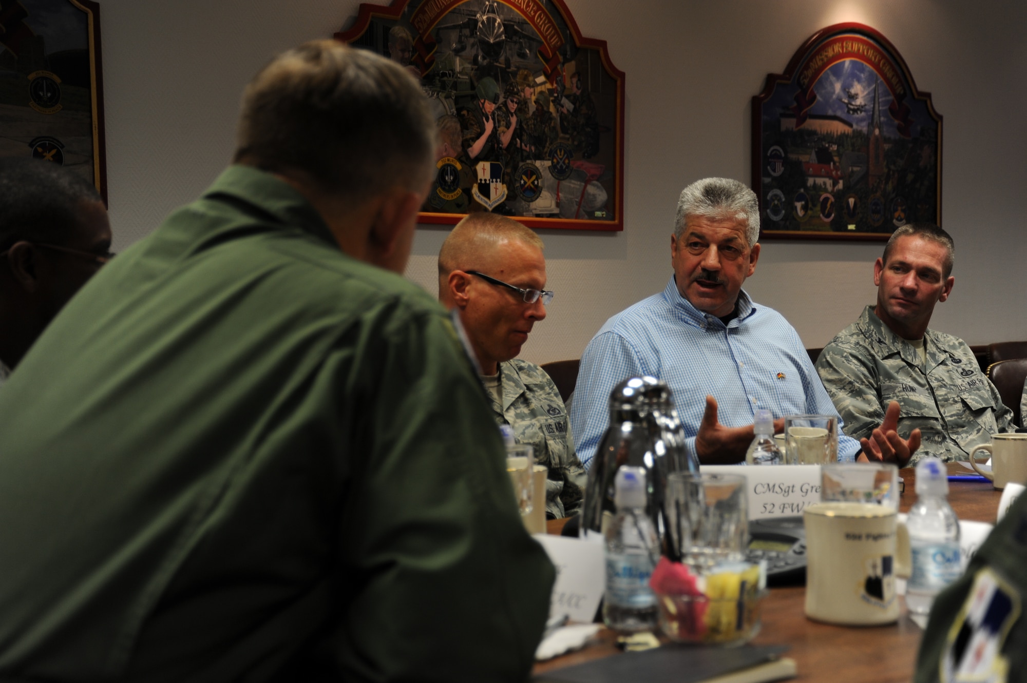 SPANGDAHLEM AIR BASE, Germany --- Klaus Rodens, mayor of Spangdahlem, center right, Germany, makes a point to Gen. Frank Gorenc, U.S. Air Forces in Europe and Air Forces Africa commander, left, during a base leadership conference at 52nd Fighter Wing Headquarters Oct. 18, 2013. The visit represented the general’s first visit to Spangdahlem since assuming command of USAFE/AFA Aug. 2. (U.S. Air Force photo by Senior Airman Joe W. McFadden / Released)
