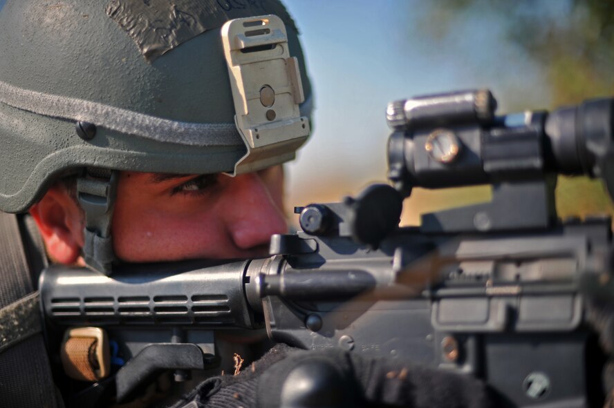 Senior Airman David Nama, 51st Security Forces Squadron fire team member, watches for opposition forces during a field training exercise near the perimeter of Osan Air Base, Republic of Korea, Oct. 18, 2013. Nama was one of many defenders that participated in the two-day exercise designed to test the 51st SFS’s ability to defend the base against any threat. (U.S. Air Force photo/Senior Airman Siuta B. Ika)