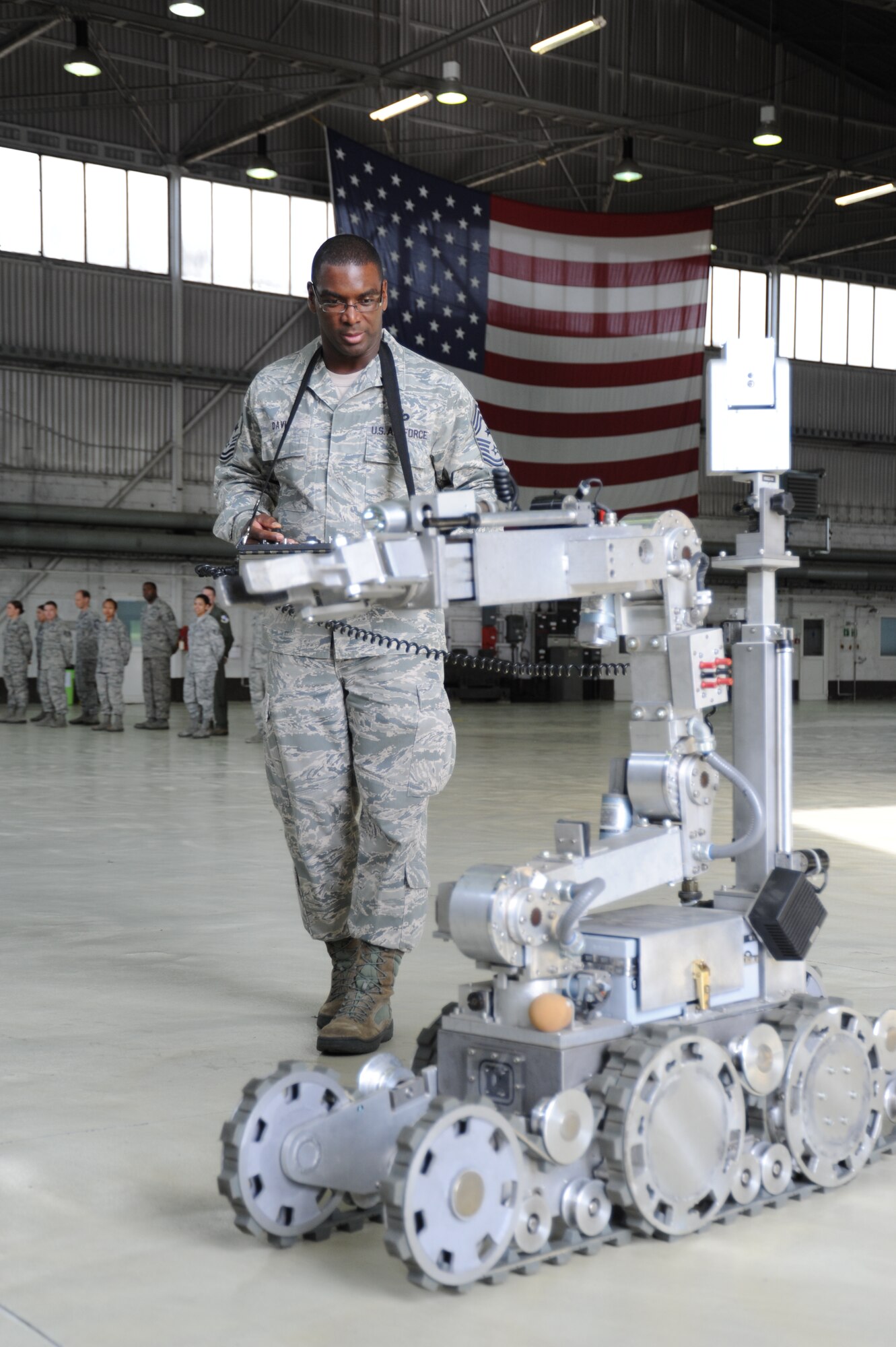 SPANGDAHLEM AIR BASE, Germany --- Chief Master Sgt. James Davis, U.S. Air Forces in Europe and Air Forces Africa command chief, operates a remote control for a bomb disposal robot during a tour Oct. 18, 2013. The chief and Gen. Frank Gorenc, USAFE/AF Africa commander. often tour USAFE bases, leaving from the major command headquarters at Ramstein Air Base, Germany. (U.S. Air Force photo by Senior Airman Joe W. McFadden / Released)