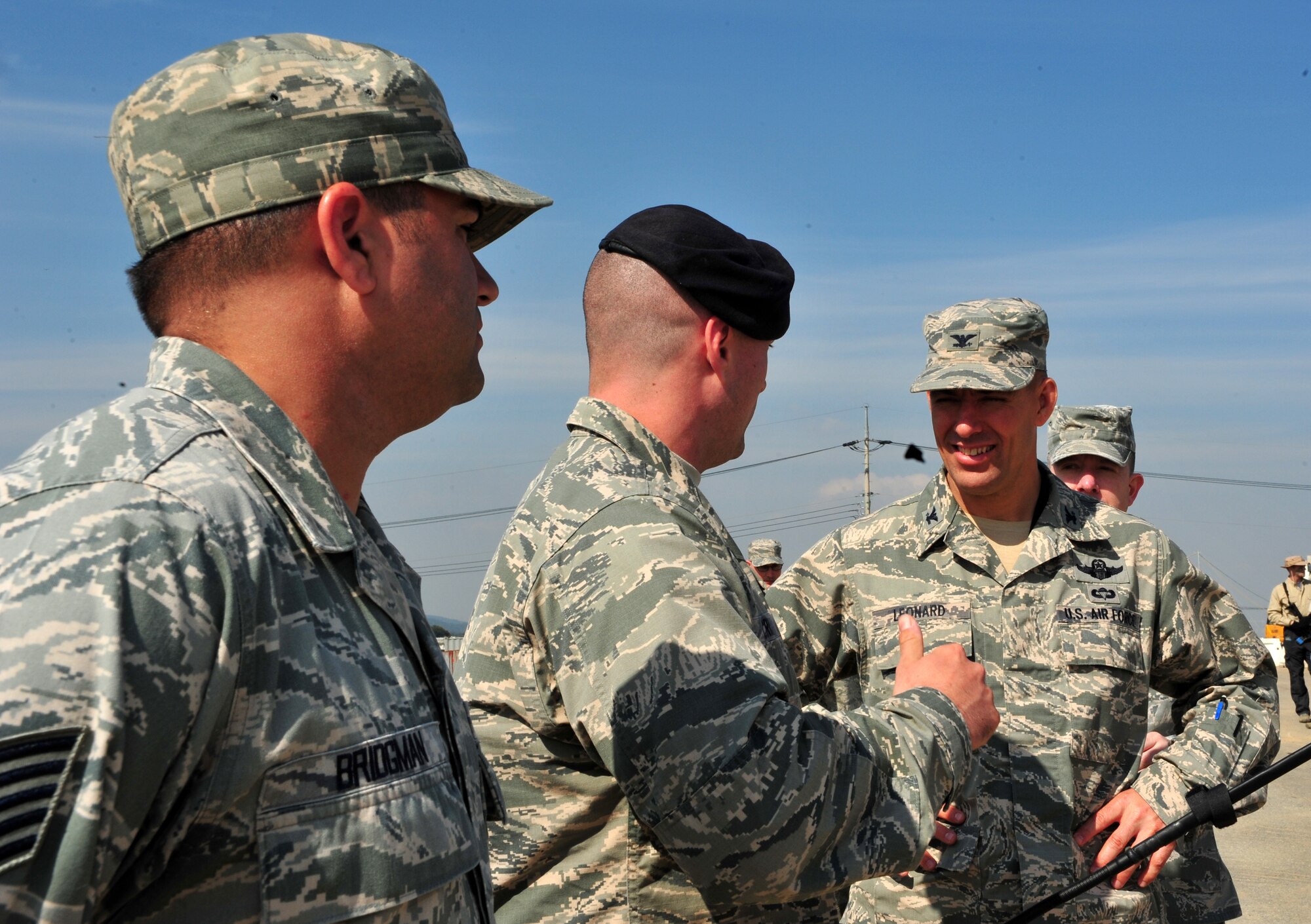 Col. Brook Leonard, 51st Fighter Wing commander, listens to 1st Lt. Jordan Criss, 51st Security Forces Squadron air base defense and intelligence officer in charge, explain a field training exercise at Osan Air Base, Republic of Korea, Oct. 17, 2013. The two-day event gave defenders a chance to practice everything from ambushes to calling in close air support. (U.S. Air Force photo/Airman 1st Class Ashley J. Thum)