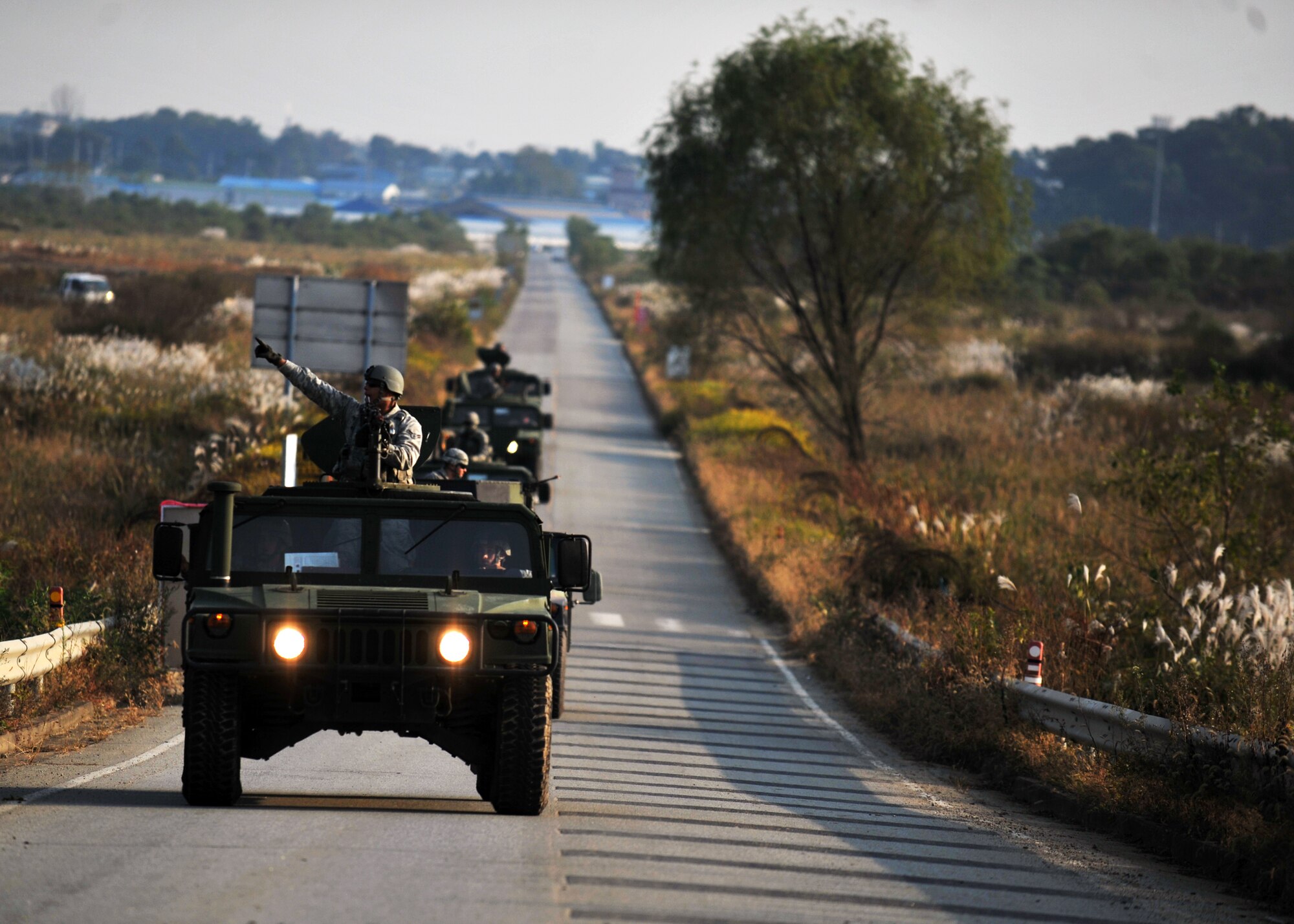 Members of the 51st Security Forces Squadron respond to a mortar threat during a field training exercise near the perimeter of Osan Air Base, Republic of Korea, Oct. 17, 2013. The 51st SFS members received intelligence that opposition forces were planning to infiltrate the base and attack the Osan flight line. (U.S. Air Force photo/Senior Airman Siuta B. Ika)