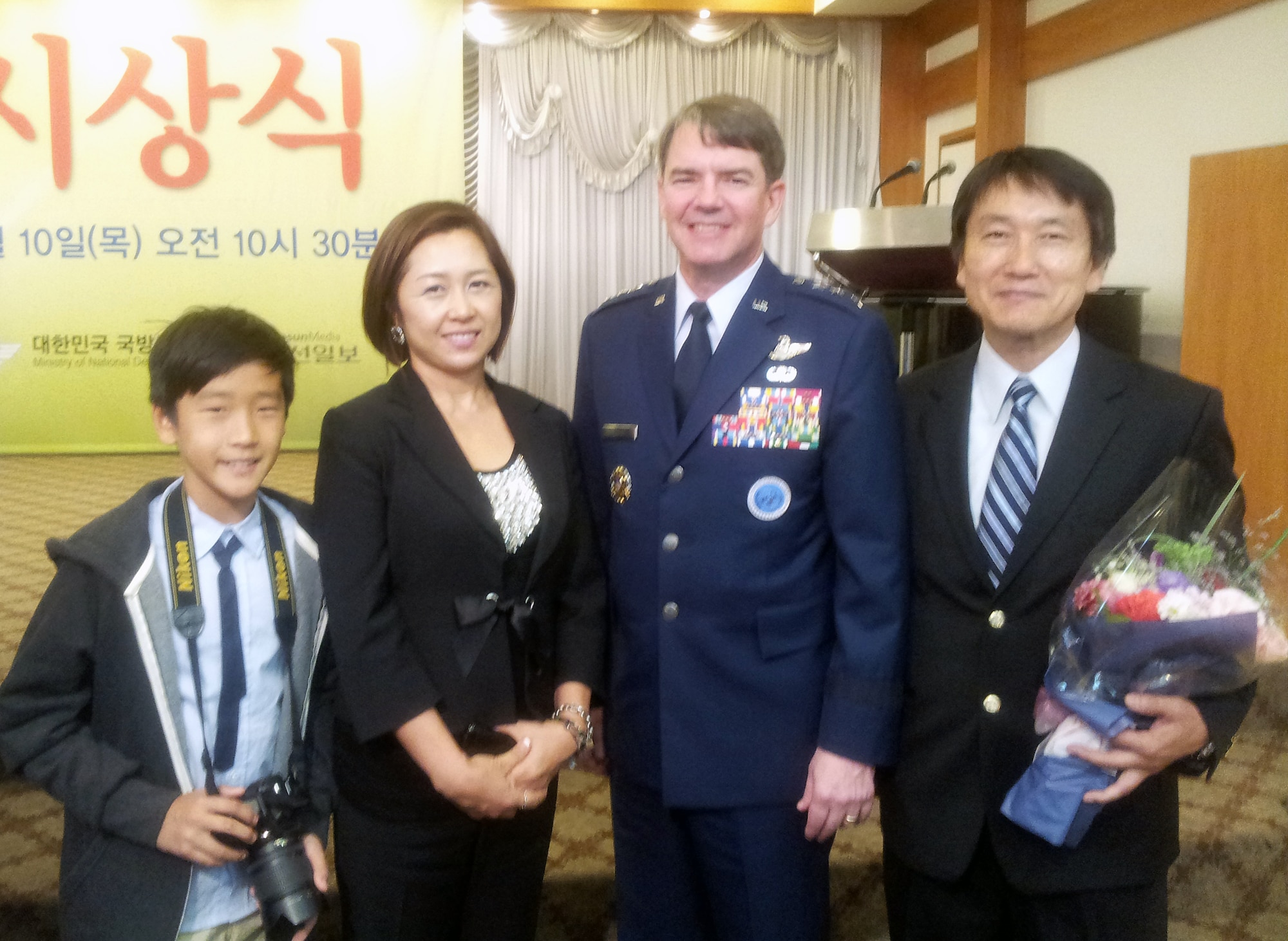 YONGSAN GARRISON, Republic of Korea - Kim Chang Yol, far right, poses with Seventh Air Force commander, Lt. Gen. Jan-Marc Jouas,his wife, Ma Ri Kim and his son, Min Sung Kim, after receiving the Republic of Korea Minister of National Defense ROK-U.S. Alliance Award at Yongsan Garrison, Republic of Korea, Oct. 10. (Photo by Dae S. Paek)
