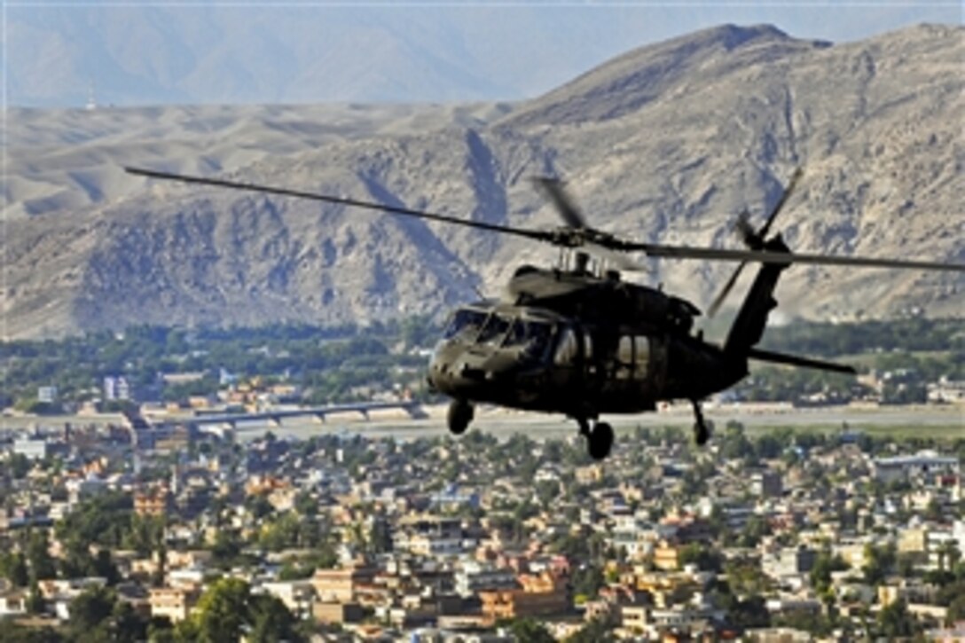 A U.S. Army UH-60L Black Hawk helicopter flies over the Nangarhar Province of Afghanistan on Oct. 17, 2013.  The Black Hawk helicopter is routinely used to conduct logistical support, air assault, and medical evacuation mission in areas not easily accessible by land across eastern and northern Afghanistan.  