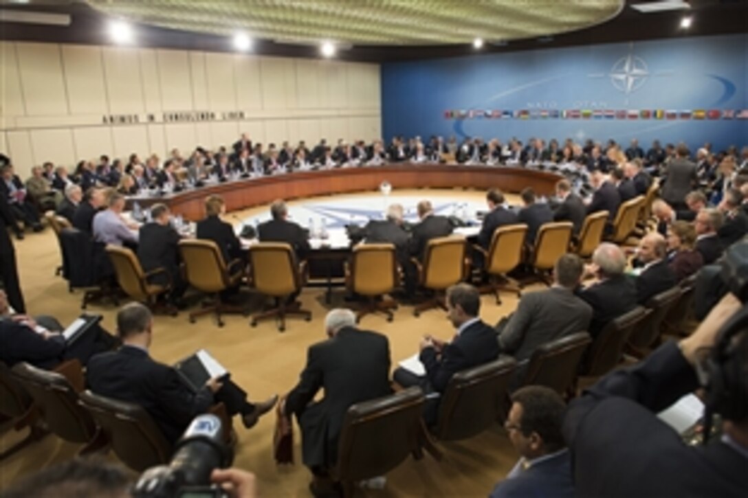 U.S. Defense Secretary Chuck Hagel, center back, participates in the North Atlantic Council meeting at NATO headquarters in Brussels, Oct. 22, 2013.