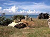 September 12, 2013, GySgt Nicholas Singh, the Vehicle Recovery Section SNCOIC, supervises recovery training during the 3rd Maintenance Battalion Field Exercise 13-2 in the Central Training Area on Okinawa, Japan. During the training, Marines used the AMK36 medium tactical vehicle replacement wrecker to pull an up-armored high-mobility multipurpose wheeled vehicle, which was mired in a ditch. The exercise provided realistic training for the Marines, as they might face these types of situations during real-world operations. Ensuring the proficiency of recovery operators ensures the Marines can operate independently within the Asia-Pacific region. Third Maintenance Battalion is part of Combat Logistics Regiment 35, 3rd Marine Logistics Group, III Marine Expeditionary Force. 