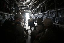 Marines with Air Delivery Platoon, Landing Support Company, 2nd Marine Logistics Group wait anxiously for a MV-22B Osprey to reach the desired altitude for them to jump out aboard Camp Lejeune, N.C., Oct. 21, 2013. Marines with Air Delivery Plt. are trained to parachute after equipment that has been air-dropped and then secure the area until ground troops arrive. (U.S. Marine Corps photo by Lance Cpl. Shawn Valosin)