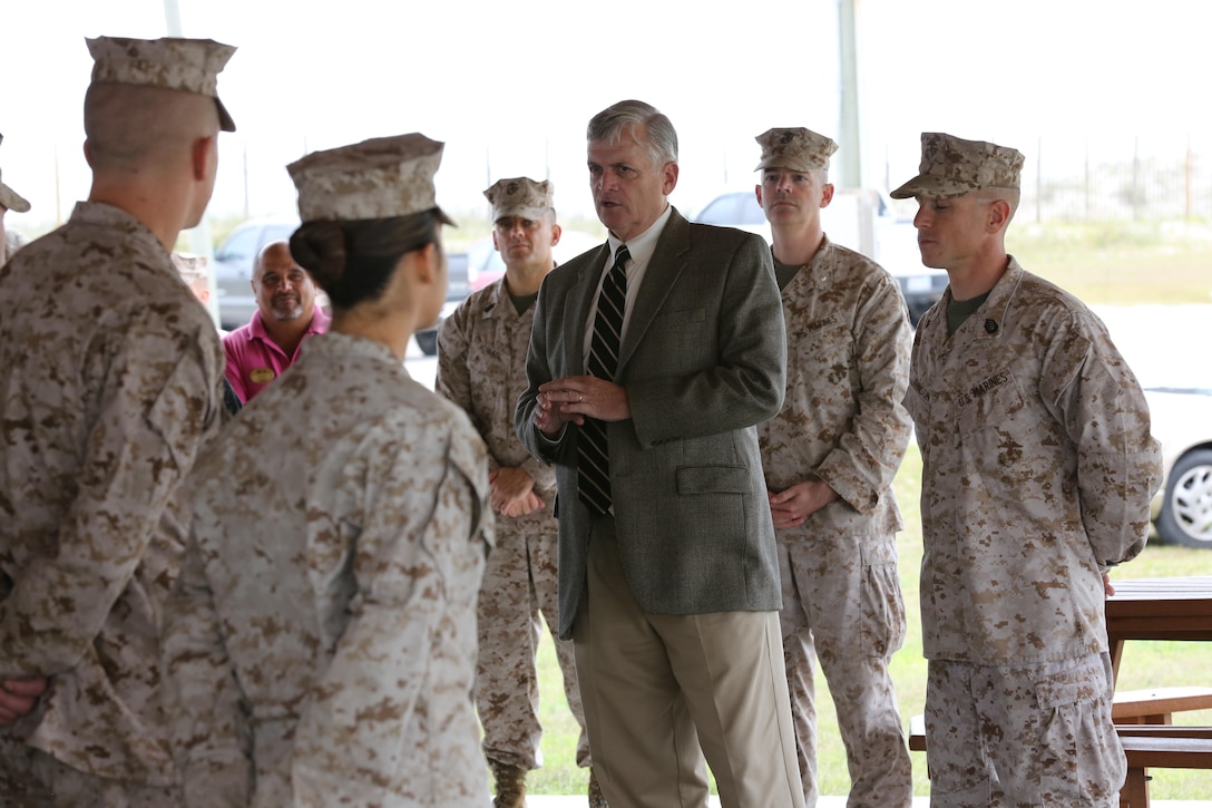 John Sollis, the assistant chief of staff with Marine Corps Community Services, speaks to Marines with beach detachment, Company A, Headquarters and Support Battalion, at Onslow Beach aboard Marine Corps Base Camp Lejeune, Oct. 16. MCCS presented certificates of appreciation to each Marine for keeping the beach safe during the summer season.

