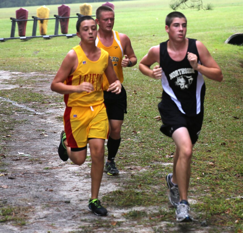 Lejeune High School's Elijah Moore runs alongside competitors during the
Coastal Plains 1A Conference Cross-Country Finals aboard Marine Corps Base
Camp Lejeune, Oct. 15.
