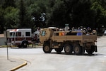 Colorado Army National Guard members assist Boulder County authorities in transporting residents being evacuated from Lyons, Colo., to Longmont, Colo., Sept. 13, 2013.