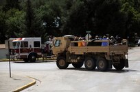 Colorado Army National Guard members assist Boulder County authorities in transporting residents being evacuated from Lyons, Colo., to Longmont, Colo., Sept. 13, 2013.