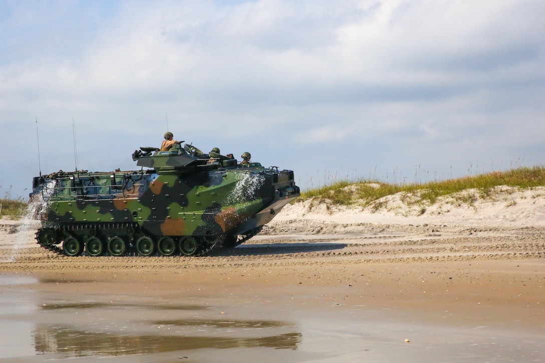 Water runs off the side of an amphibious assault vehicle with 2nd Assault Amphibian Battalion, 2nd Marine Division, during an amphibious operation at Onslow Beach aboard Marine Corps Base Camp Lejeune, Oct. 18, 2013. “The amphibious operations we provide are a huge asset to the Marine Corps because we are who keeps the Marine Corps amphibious,” said Capt. Bret Presley, the Bravo Company commander, and Odessa, Texas native. “Without us, Marines would have to rely on other agencies in order to conduct a beach landing.”