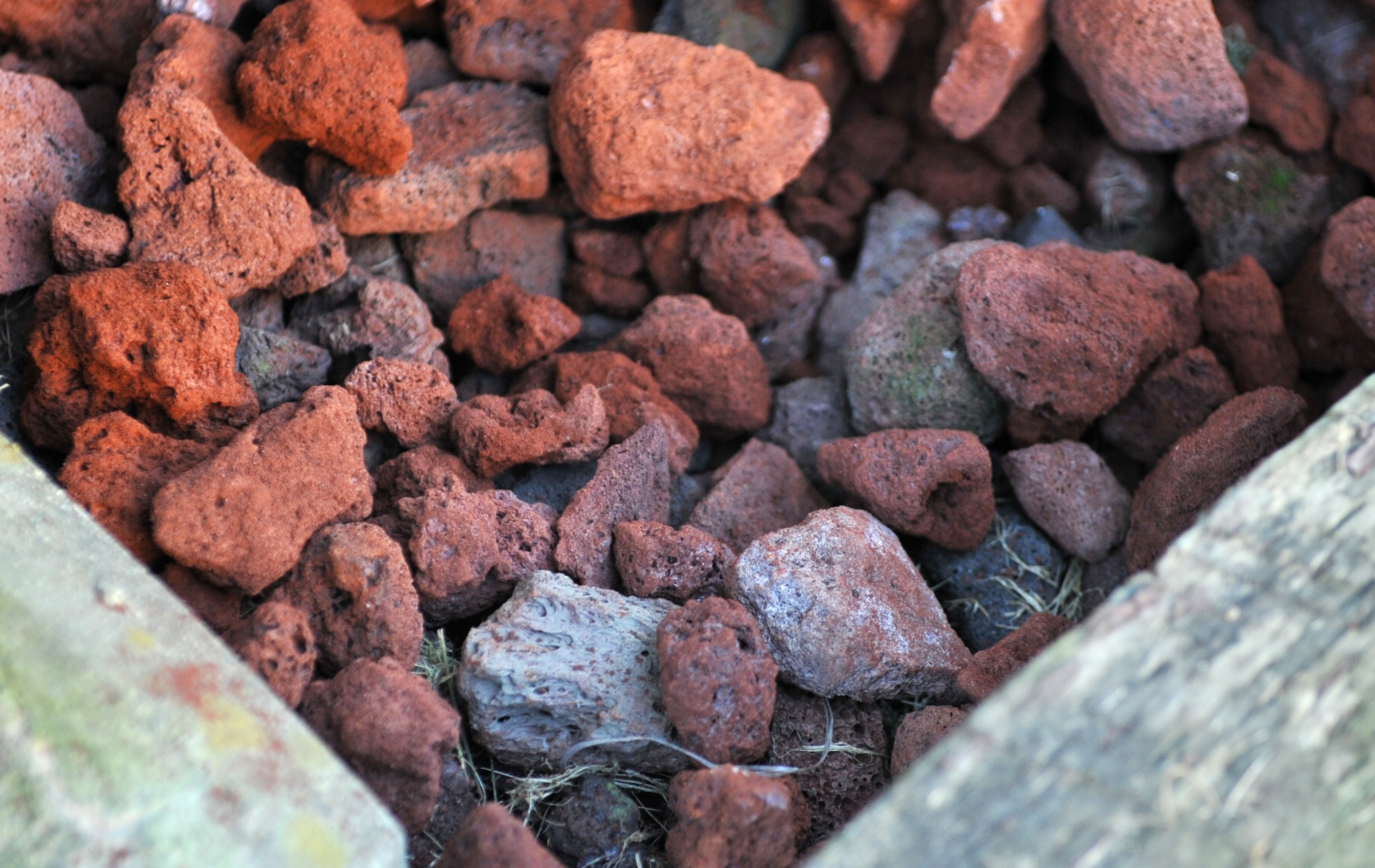 Lava rocks soak up the afternoon sun in a rock bed outside Bldg. 1436 at Osan Air Base, Republic of Korea, Oct. 23, 2013. Five pallets of lava rocks were used to put the finishing touches on the building’s “Worst Dorm First” transformation. (U.S. Air Force photo/Airman 1st Class Ashley J. Thum)