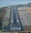 Airmen from the 647th Civil Engineer Squadron Engineering Assistants and Structures Flight recently teamed up to paint the first-ever assault landing zone at the Navy’s Barking Sands Pacific Missile Range Facility on the island of Kauai. The 11-man crew, which included two Navy civilian contractors, completed the project in 36 hours. (Courtesy photo)