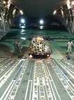 Staff Sgt. Michael Mac Leod, 647th Civil Engineer Squadron Structures Flight, backs up to a C-17 Globemaster III before unloading the equipment which will be used to survey and paint the assault landing zone at the Navy’s Barking Sands Pacific Missile Range Facility. Barking Sands, a multi-dimensional testing and training missile range located on the island of Kauai, is the largest of its kind in the world; supporting surface, subsurface, air and space operations. The recent work of the PMRF leadership and 647th CES Airmen will now also allow the runway to serve as a temporary ALZ for the active-duty 535th and the Air National Guard’s 204th  C-17 Airlift Squadrons. (Courtesy photo)