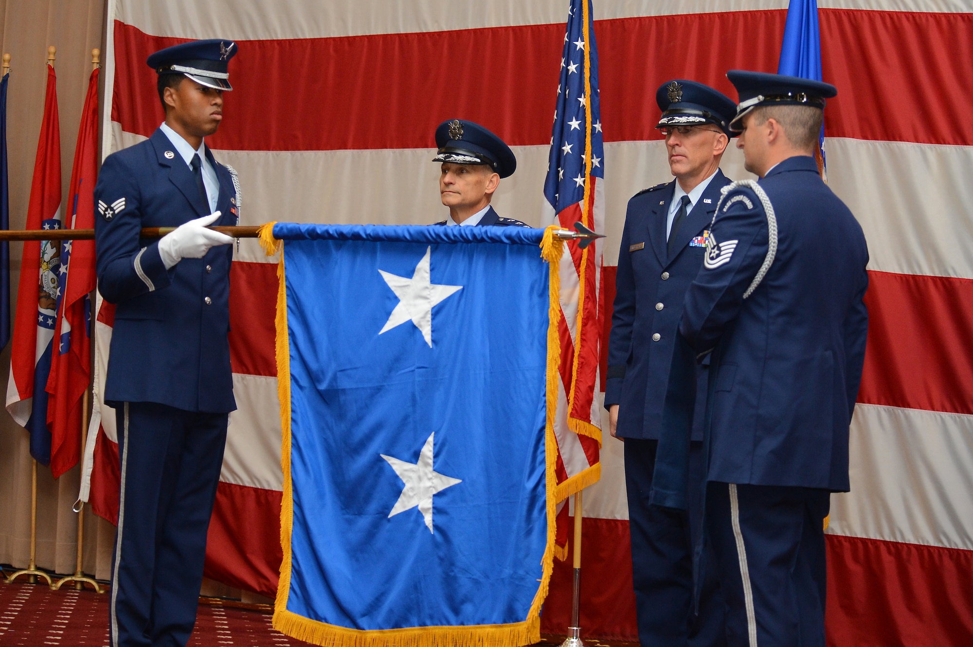 Airmen from the Barksdale Honor Guard present Maj. Gen. Scott Vander Hamm, the new Eighth Air Force commander, with his new general officer flag during his promotion ceremony at Barksdale Air Force Base, La., Oct. 23, 2013. (U.S. Air Force photo/Senior Airman Micaiah Anthony)