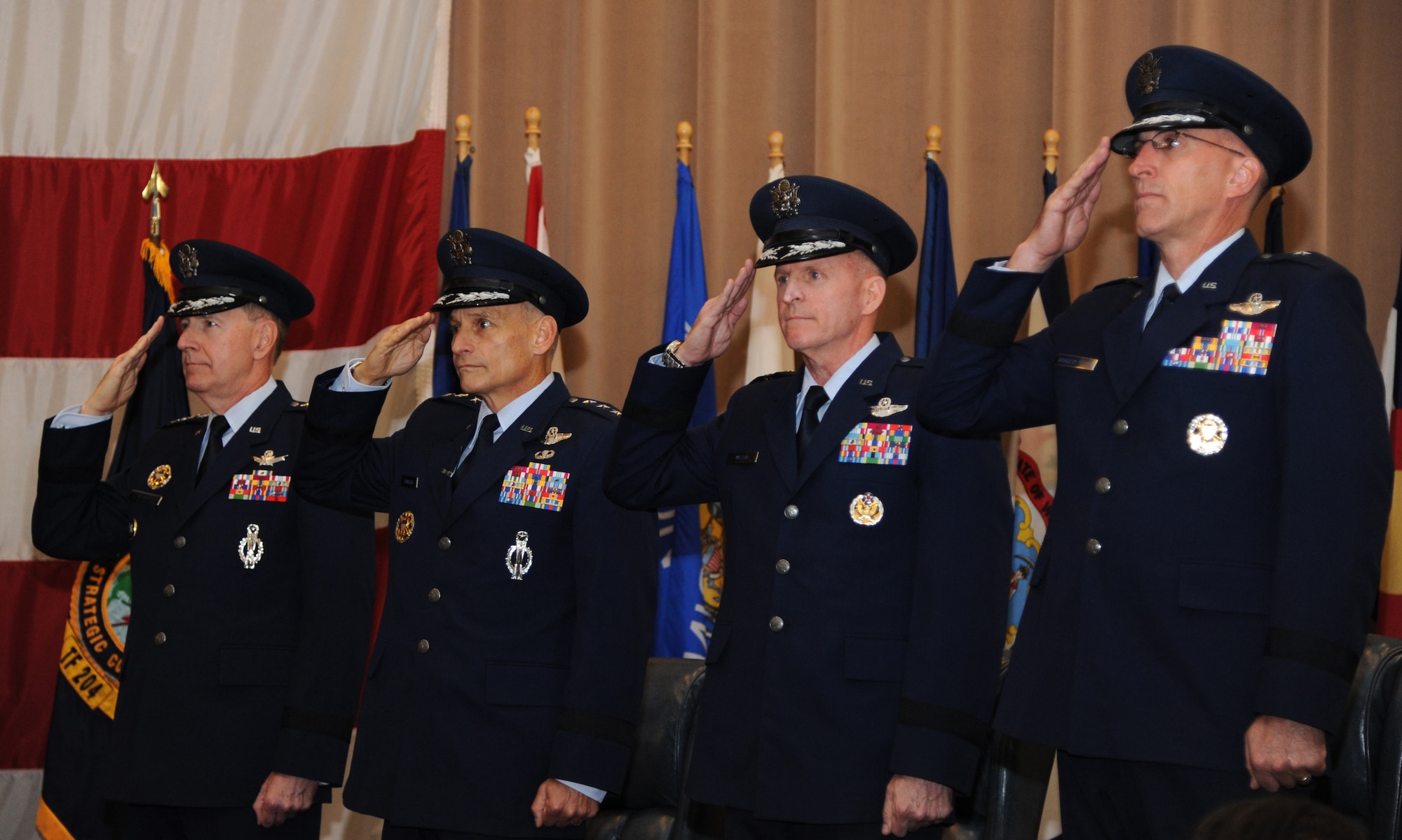 Gen. C. Robert Kehler, commander of U.S. Strategic Command; Lt. Gen. Jim Kowalski, commander of Air Force Global Strike Command; Maj. Gen. Stephen Wilson, outgoing Eighth Air Force commander, Joint Functional Component Commander for Global Strike, and Task Force 204 commander; and Brig. Gen. Scott Vander Hamm, render a salute during a promotion and change of command ceremony at Barksdale Air Force Base, La., Oct. 23, 2013. During the ceremony Vander Hamm was promoted to the rank of major general and took command from Wilson. (U.S. Air Force photo/Senior Airman Joseph A. Pag?n Jr.)
