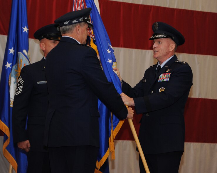 Lt. Gen. Stephen Wilson accepts the Air Force Global Strike Command flag from Air Force Chief of Staff Gen. Mark A. Welsh III during a change of command ceremony at Barksdale Air Force Base, La., Oct. 23, 2013. AFGSC?s mission is to develop and provide combat ready forces for safe, secure, and effective nuclear deterrence and global strike operations to support the President of the United States and combatant commanders. (U.S. Air Force photo/Senior Airman Joseph A. Pag?n Jr.)