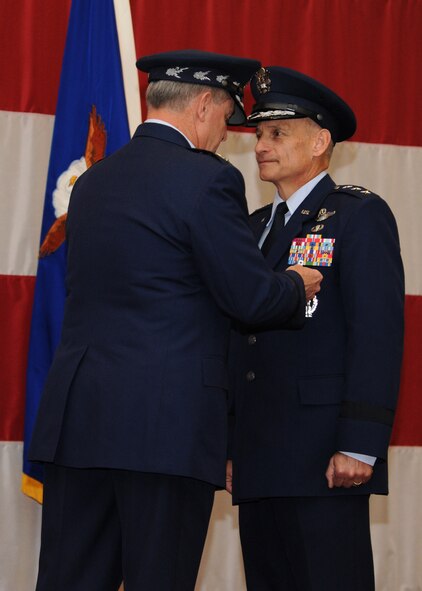 Air Force Chief of Staff Gen. Mark A. Welsh III awards the Distinguished Service Medal to Lt. Gen. Jim Kowalski during the Air Force Global Strike Command ceremony at Barksdale Air Force Base, La., Oct. 23, 2013. Kowalski has been an integral part of AFGSC since the command?s beginning.  During his farewell address, he praised the Global Strike Airmen for their hard work and dedication, including improving readiness by 37%; reducing outstanding security objectives by nearly 50%; winning the General Creech award for the best aircraft maintenance of any Air Force major command; standing up the command?s first ever 24/7 tactical response force; pushing ICBM on-alert levels to their highest numbers since 2011; and leading U.S. Strategic Command?s first-ever combat action during Operation Odyssey Dawn. (U.S. Air Force photo/Senior Airman Joseph A. Pag?n Jr.)