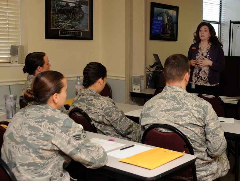 Amy Soeder, Airman and Family Readiness Center community readiness technician, speaks with new parents during a Bundles for Babies class at the A&FRC on Barksdale Air Force Base, La., Oct. 23, 2013. The class is designed to help new parents gain knowledge of financial management before their child is born. It is one of many programs across the base that help support Airmen and their families. (U.S. Air Force photo/Senior Airman Kristin High)