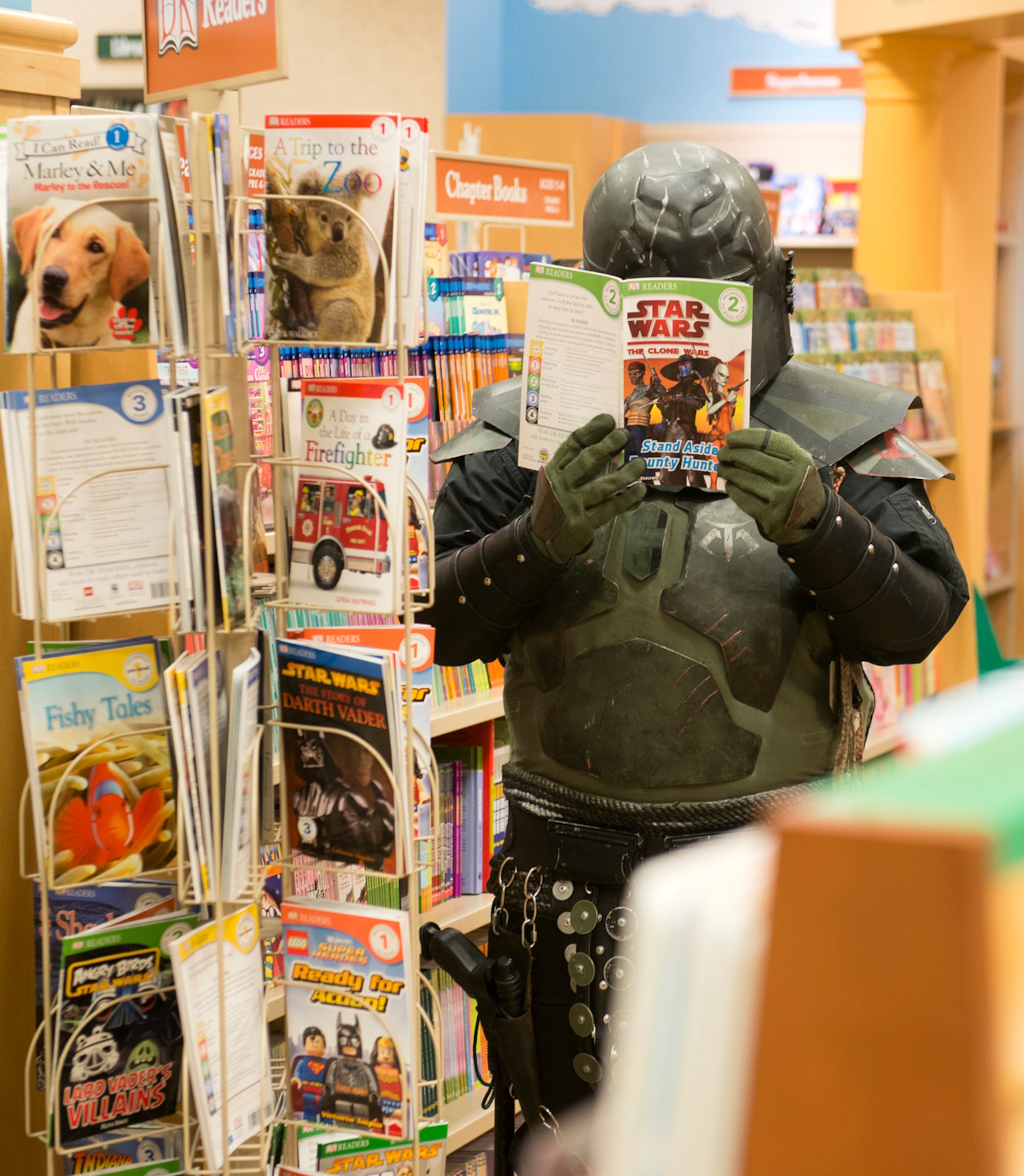 Jade Pardue, a member of the 501st Legion, Vader's Fist, reads a Star Wars book at Barnes & Noble in Anchorage Oct. 5. Members of the legion attended the second annual Star Wars Reads Day to encourage kids and adults to read. (U.S. Air Force photo/Staff Sgt. Zachary Wolf)