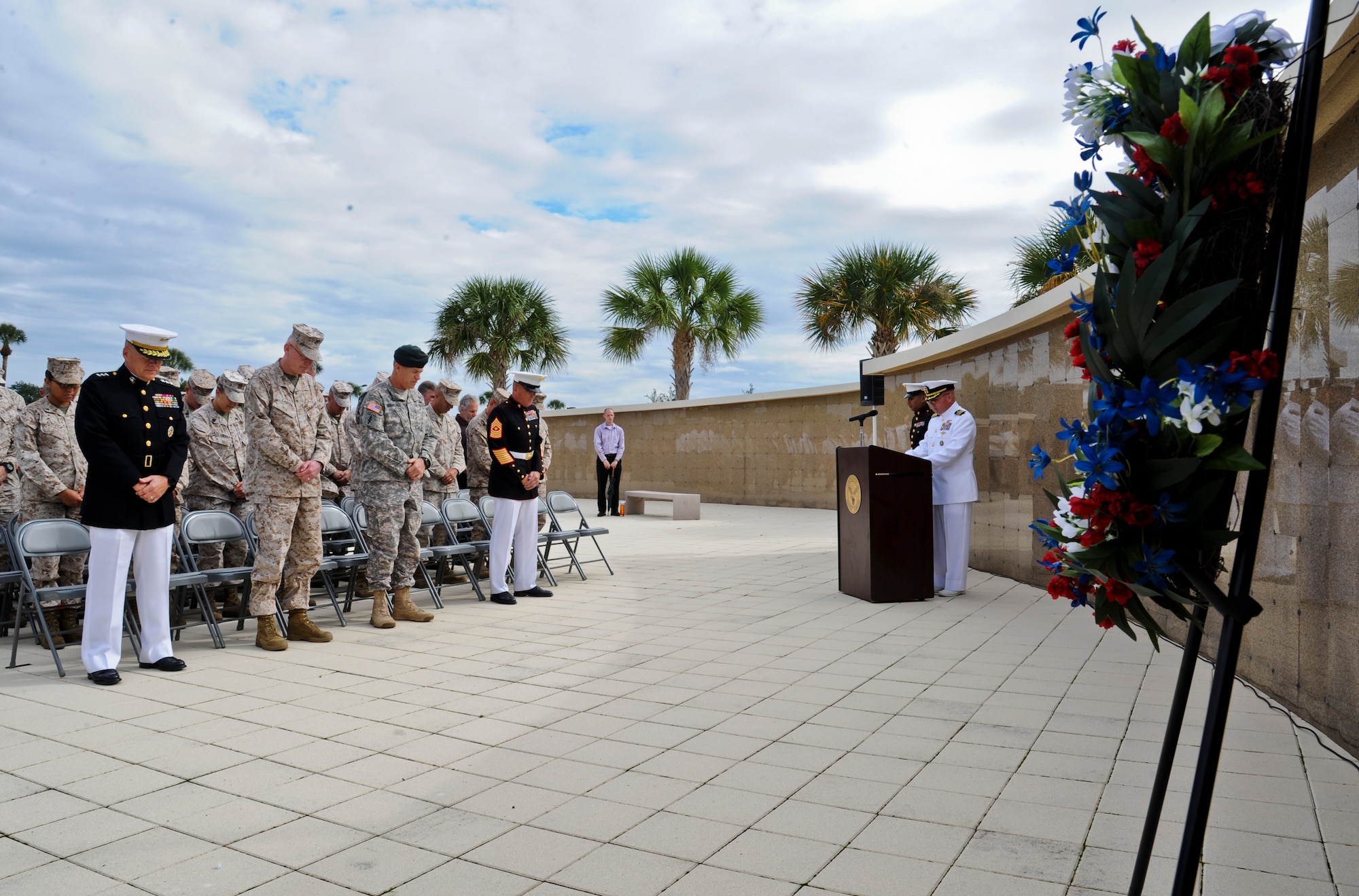 More than 100 military members from both U.S. and coalition forces bow their head during a benediction at the Beirut memorial observance at MacDill Air Force Base, Fla., Oct. 23, 2013. (U.S. Air Force photo by Airman 1st Class Ned T. Johnston/Released)