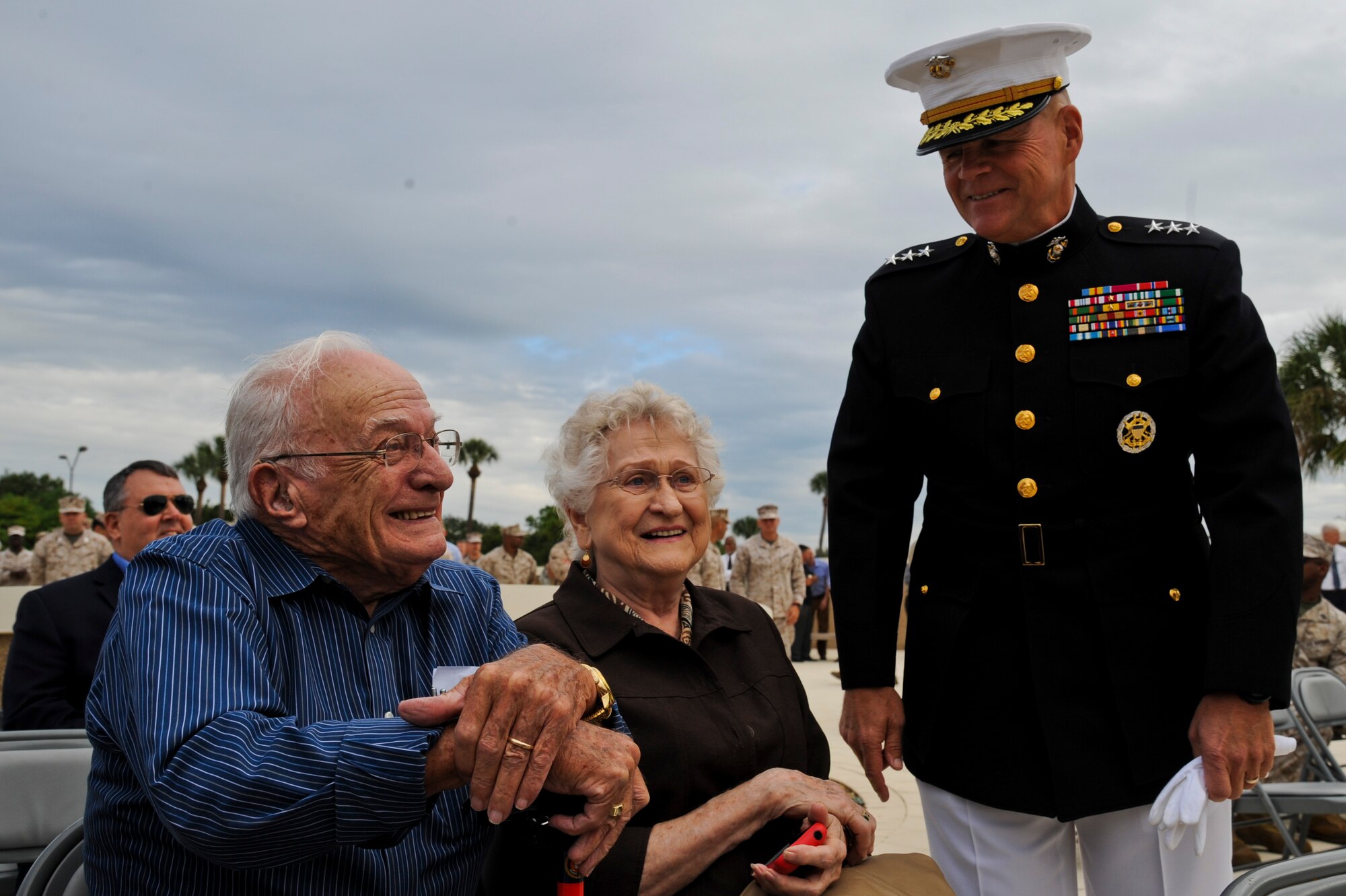 Lt. Gen. Robert B. Neller, Marine Corps Forces Central Command commander, speaks with Nelson Weyl and Peggy Weyl, the parents of Staff Sgt. John R. Weyl, a Marine killed in the 1983 Beirut barracks bombing, at the Beirut memorial observance at MacDill Air Force Base, Fla., Oct. 23, 2013. More than 100 military members from both U.S. and coalition forces, Beirut veterans, and family members of those whose lives were taken were in attendance. (U.S. Air Force photo by Airman 1st Class Ned T. Johnston/Released)