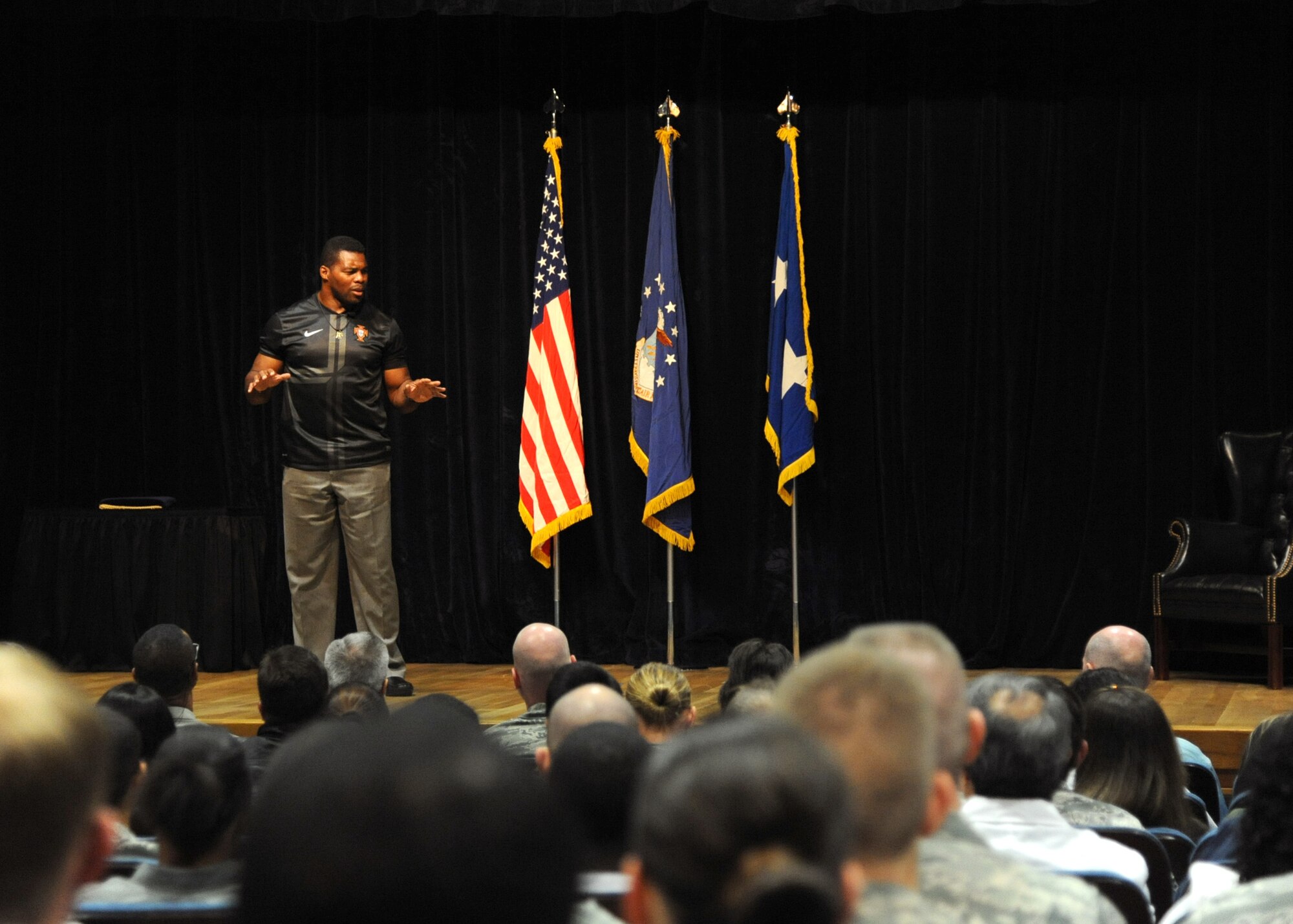 Herschel Walker speaks to more than 200 personnel from the 59th Medical Wing at the Wilford Hall Ambulatory Surgical Center, Oct. 23, 2013, at Joint Base San Antonio-Lackland, Texas. As part of the Department of Defense Patriot Support Program’s Anti-stigma campaign, Walker visits military installations across the country to encourage service members to seek help for mental health and substance abuse issues. (U.S. Air Force photo/Staff Sgt. Jerilyn Quintanilla) 