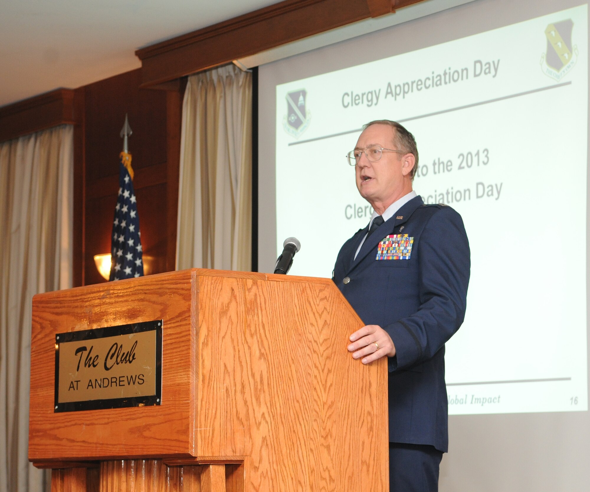 Chaplain Capt. Anthony Wade leads prayer during Clergy Appreciation Day at The Club at Andrews Oct. 22, 2013. Attendees ate lunch, listened to guest speakers share their stories and participated in prayer. Capt. Wade is a 11th Wing Protestant chaplain. (U.S. Air Force photo/Airman 1st Class Joshua Dewberry)