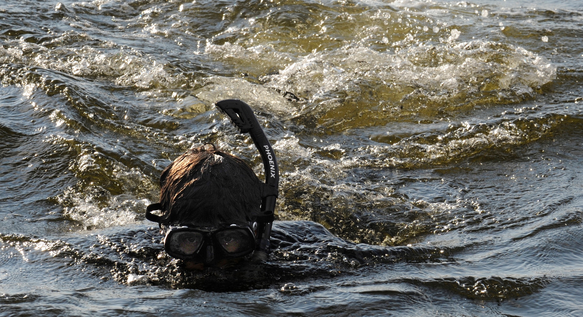 Staff Sgt. Daniel Johnson, 23rd Special Tactics Squadron combat controller, swims in the Santa Rosa Sound Oct. 17, 2013. Johnson was on standby as part of the emergency response team for an upcoming CV-22 Osprey night mission.   (U.S. Air Force photo/Staff Sgt. Jeff Andrejcik)