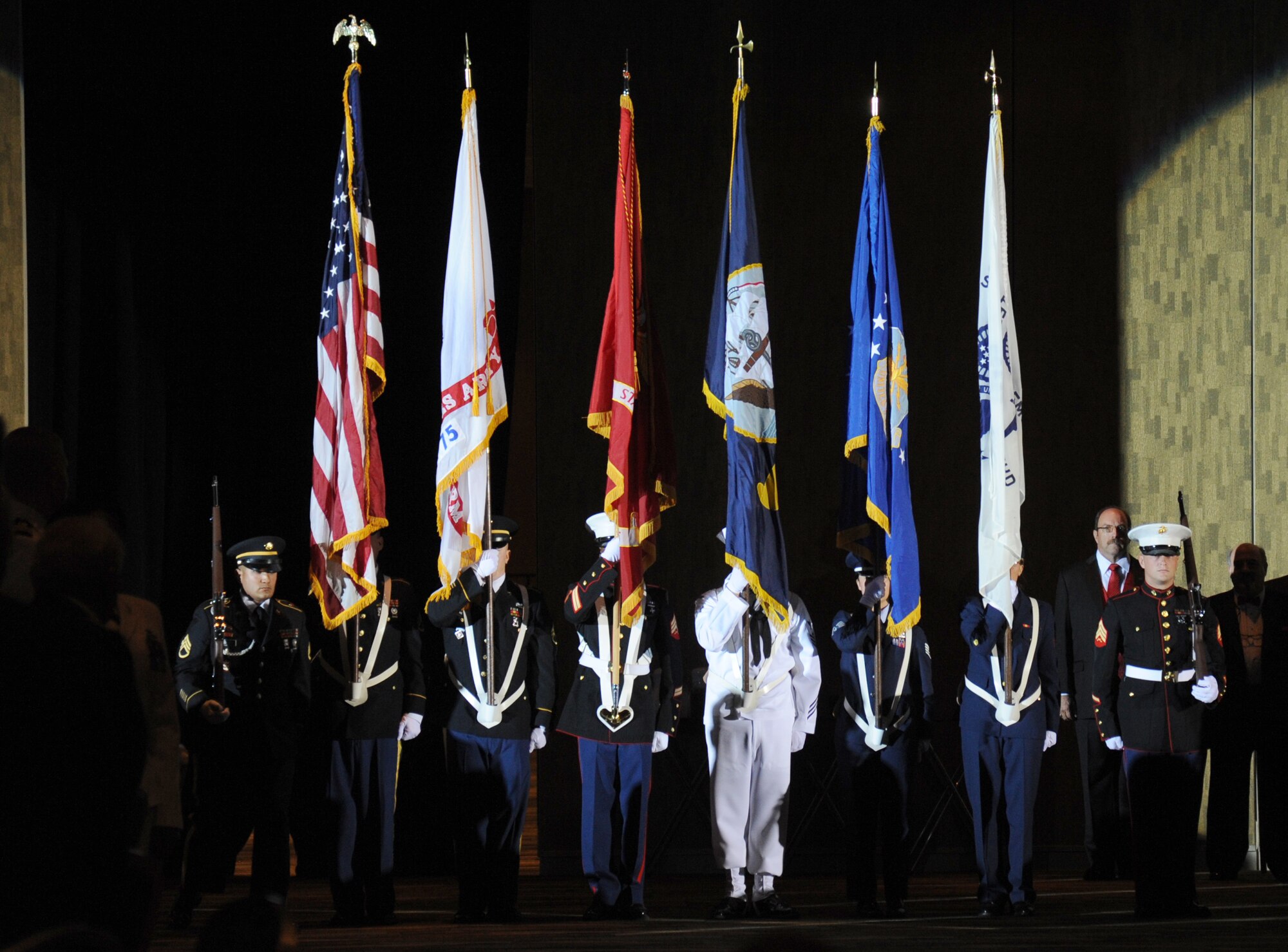 The color guard representing each branch of the military services prepares to post the colors during the 35th Annual Salute to the Military Oct. 22, 2013, at the Mississippi Coast Coliseum in Biloxi, Miss.  (U.S. Air Force photo by Kemberly Groue)